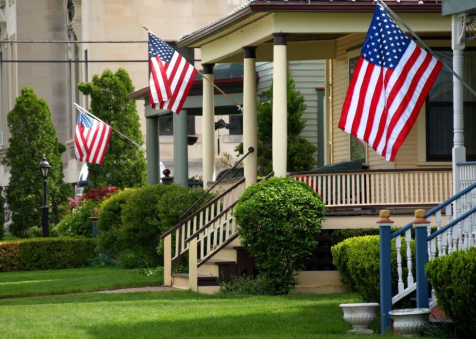Small American homes with American flags on the porch.