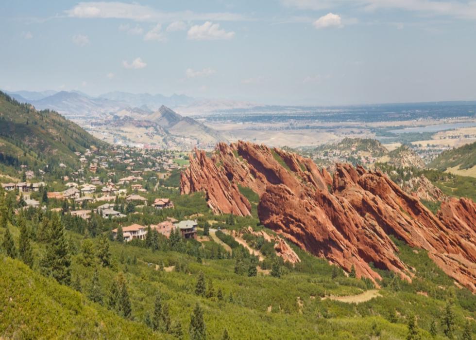 Angled sandstone cliffs and nearby homes.
