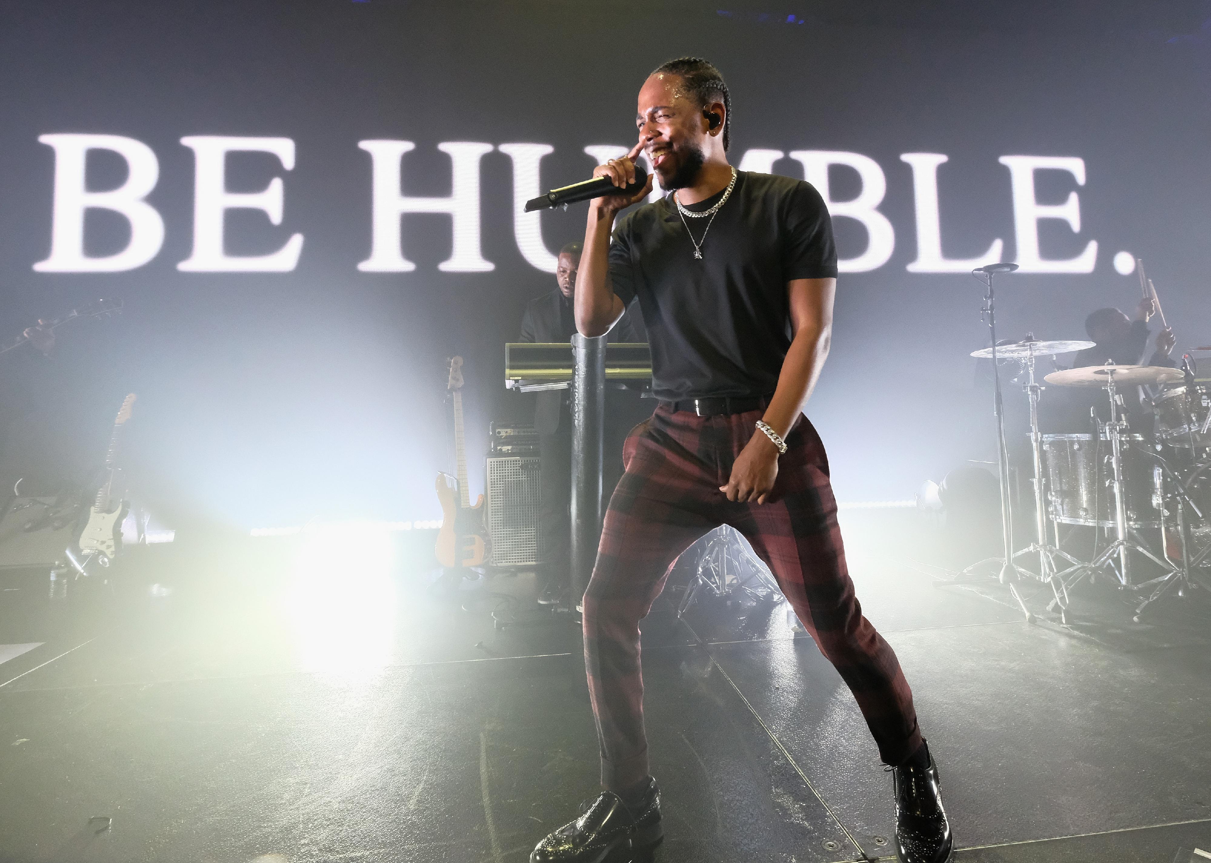Kendrick Lamar sings onstage