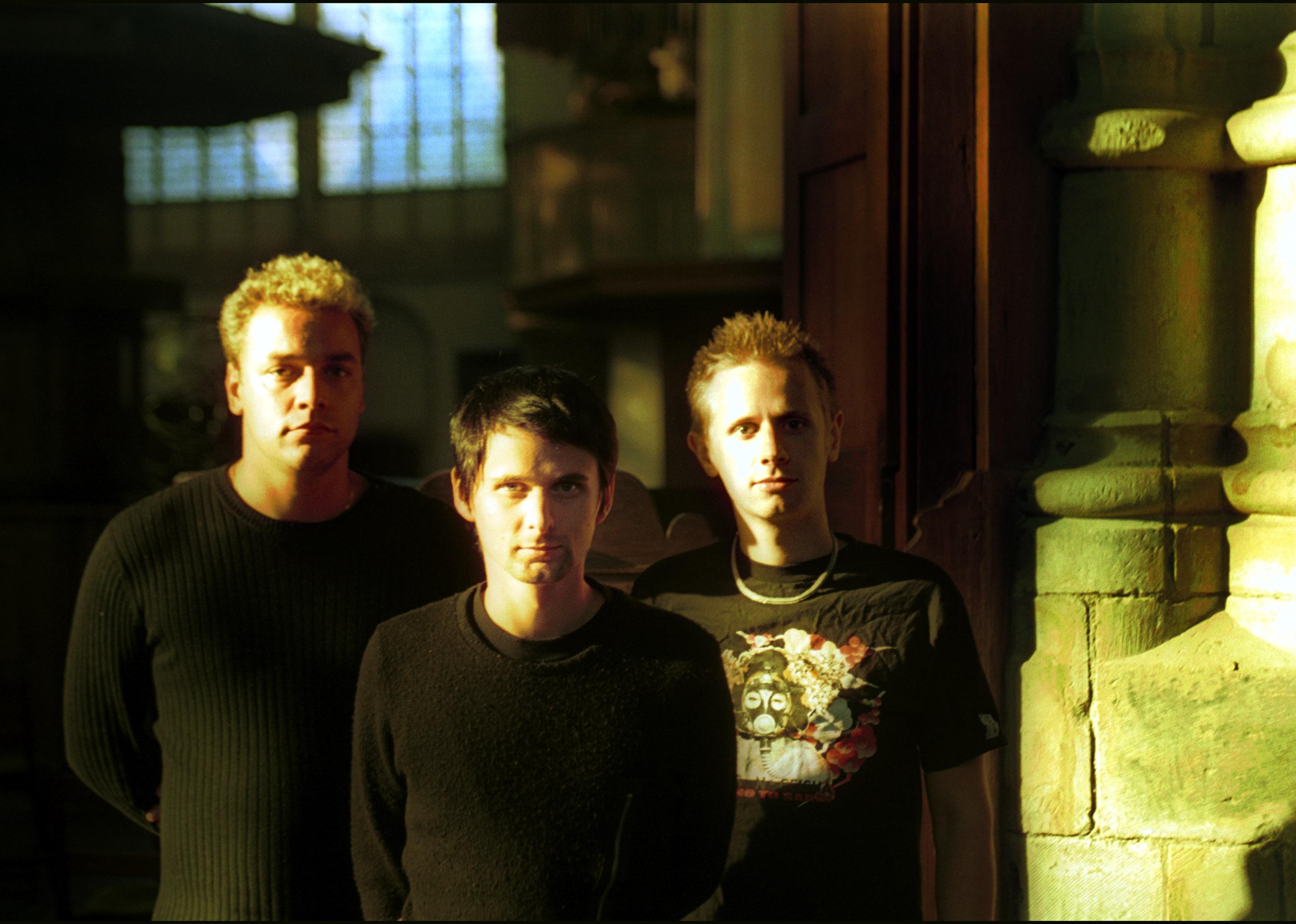 Muse bandmembers pose for a photo