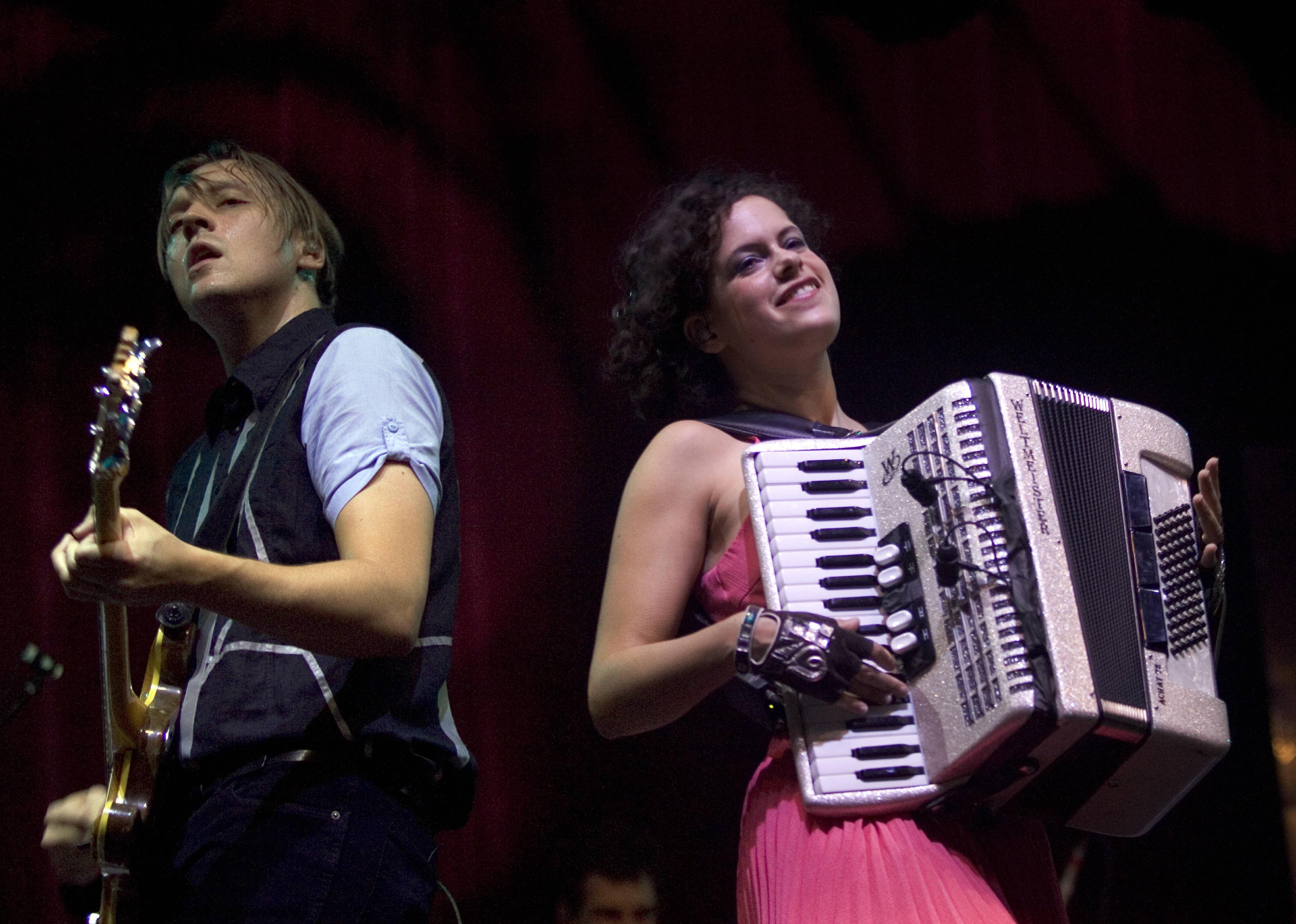Arcade Fire play at a concert