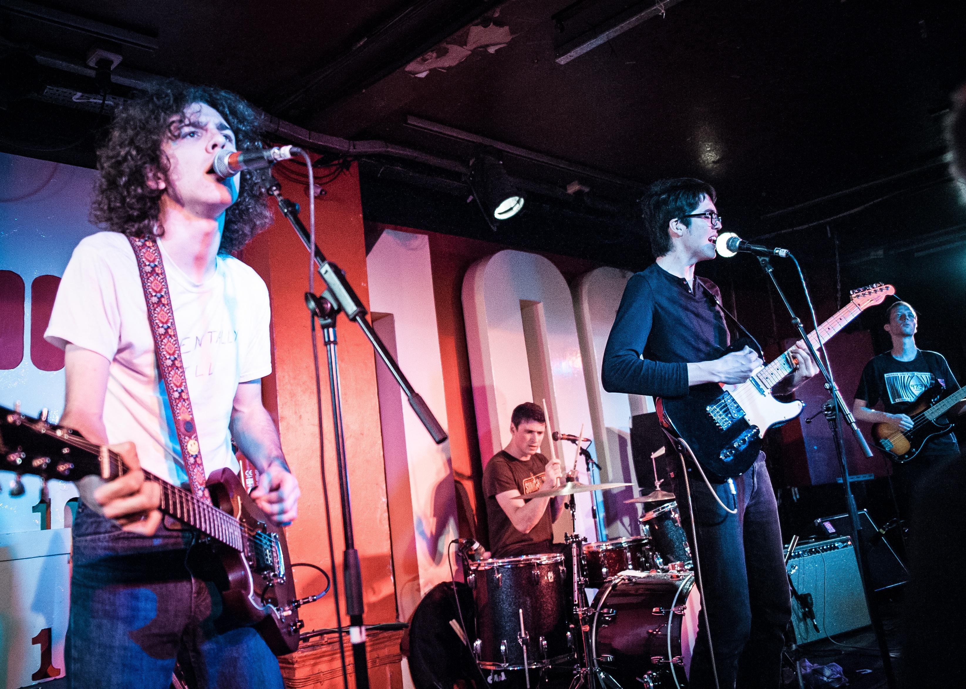 Car Seat Headrest sing a song onstage