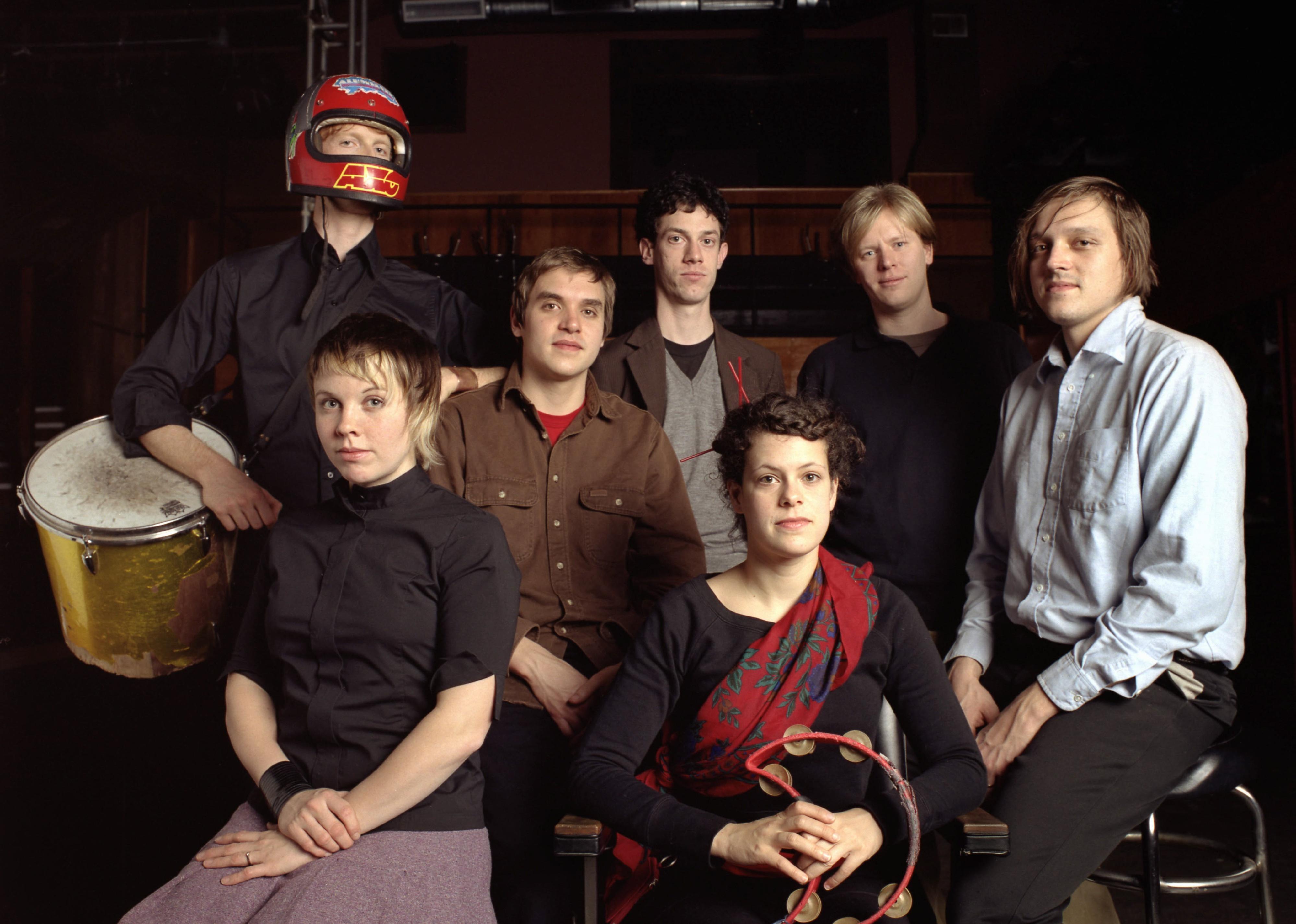 Arcade Fire pose for a photo