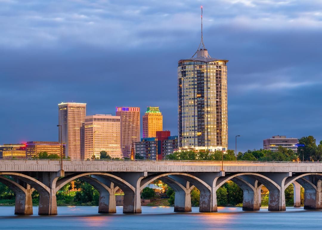 Tulsa downtown skyline on the Arkansas River at dusk.