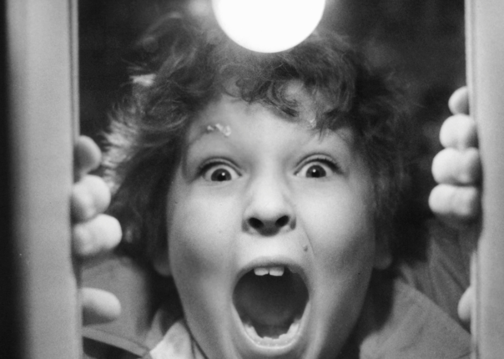 Jeff Cohen shouting through a hole in the door in 'Goonies'.