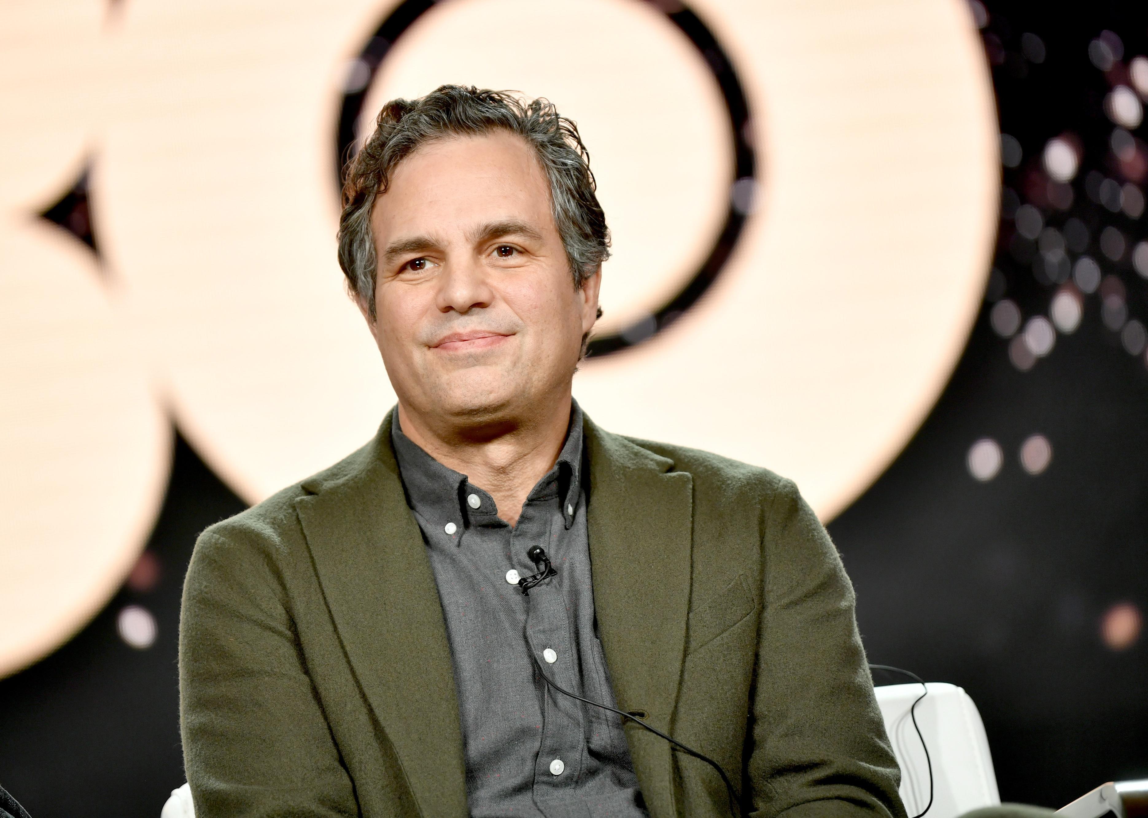 Mark Ruffalo in a green blazer onstage.