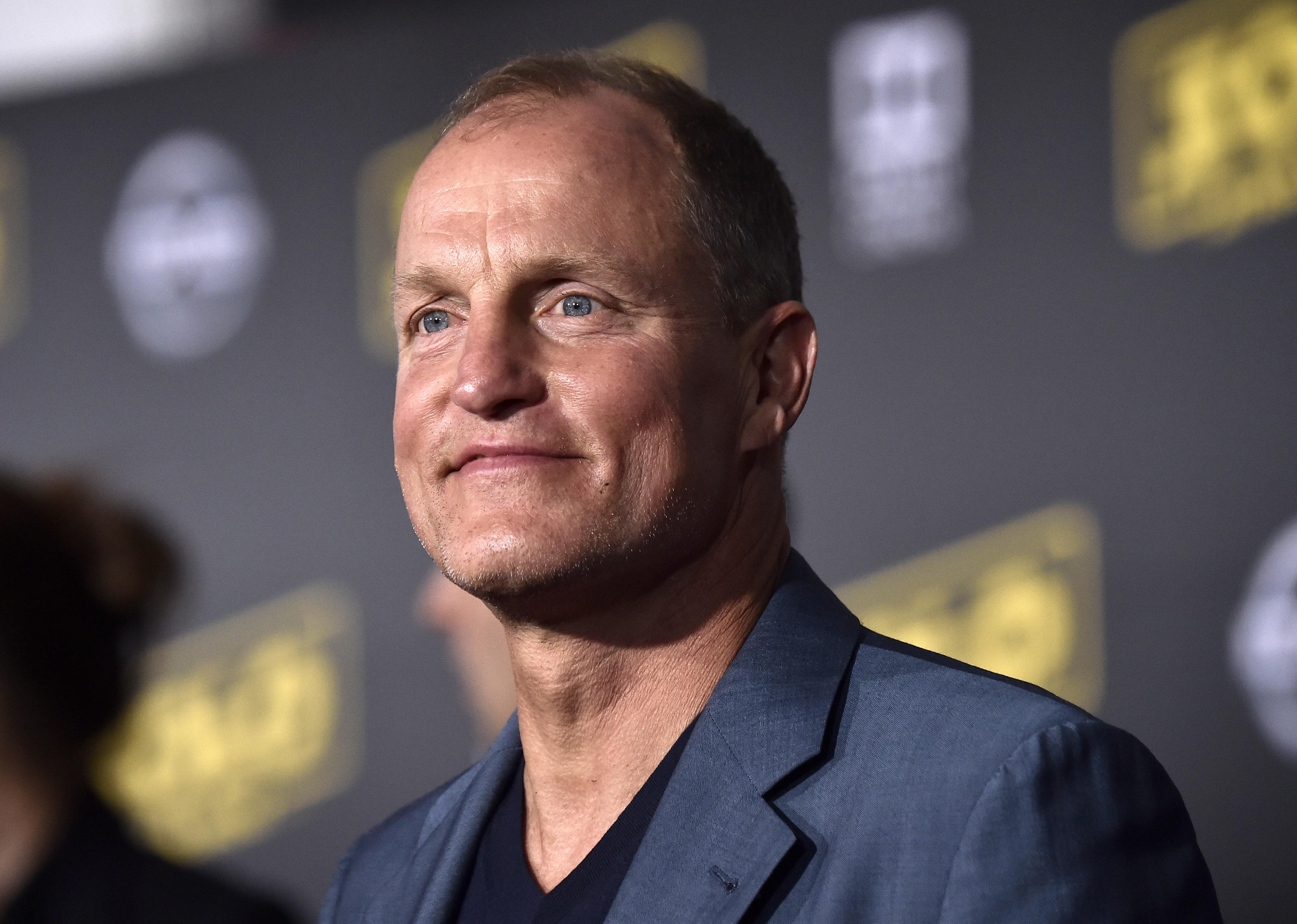 Woody Harrelson in a blue blazer.