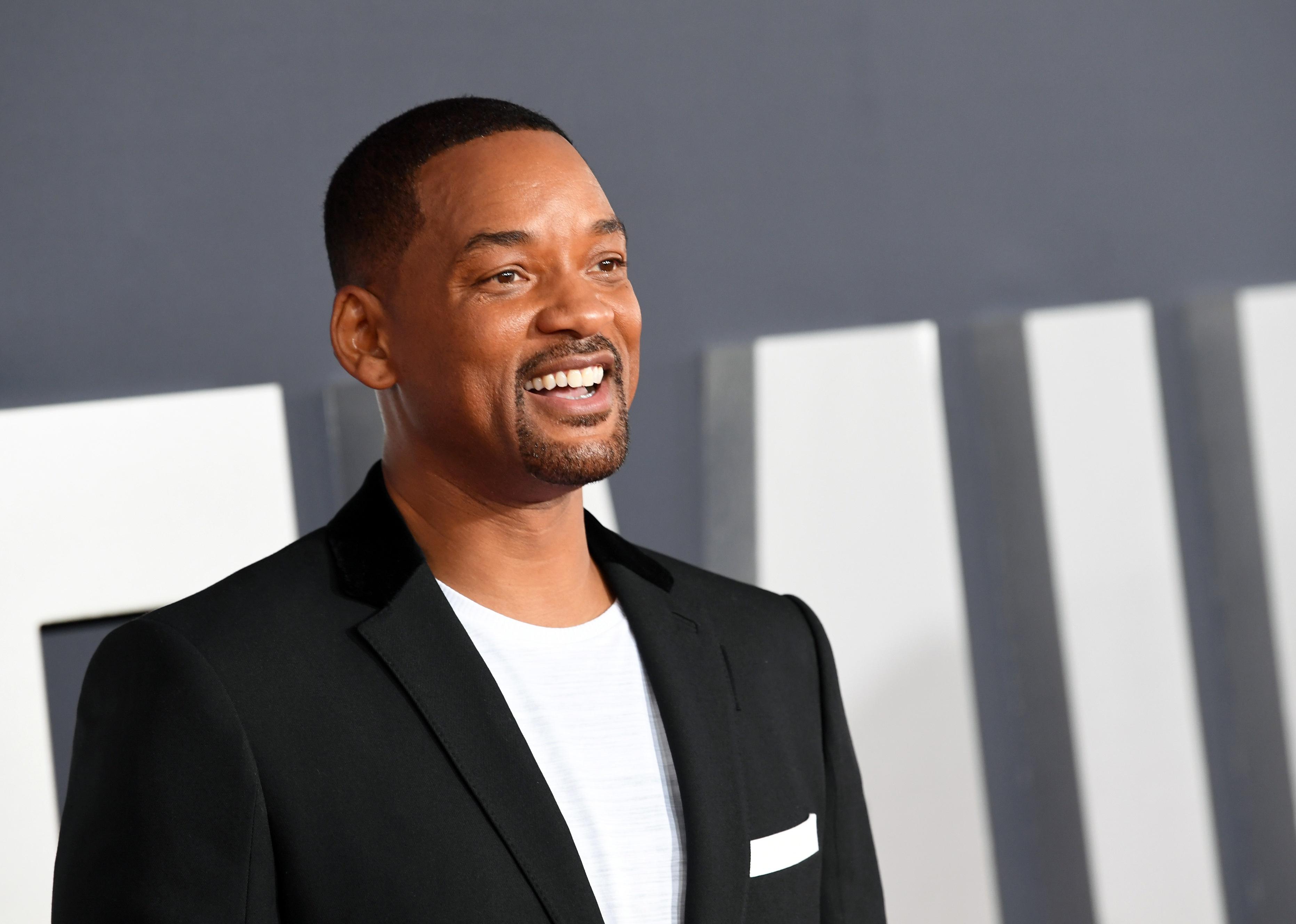 Will Smith in a black blazer.