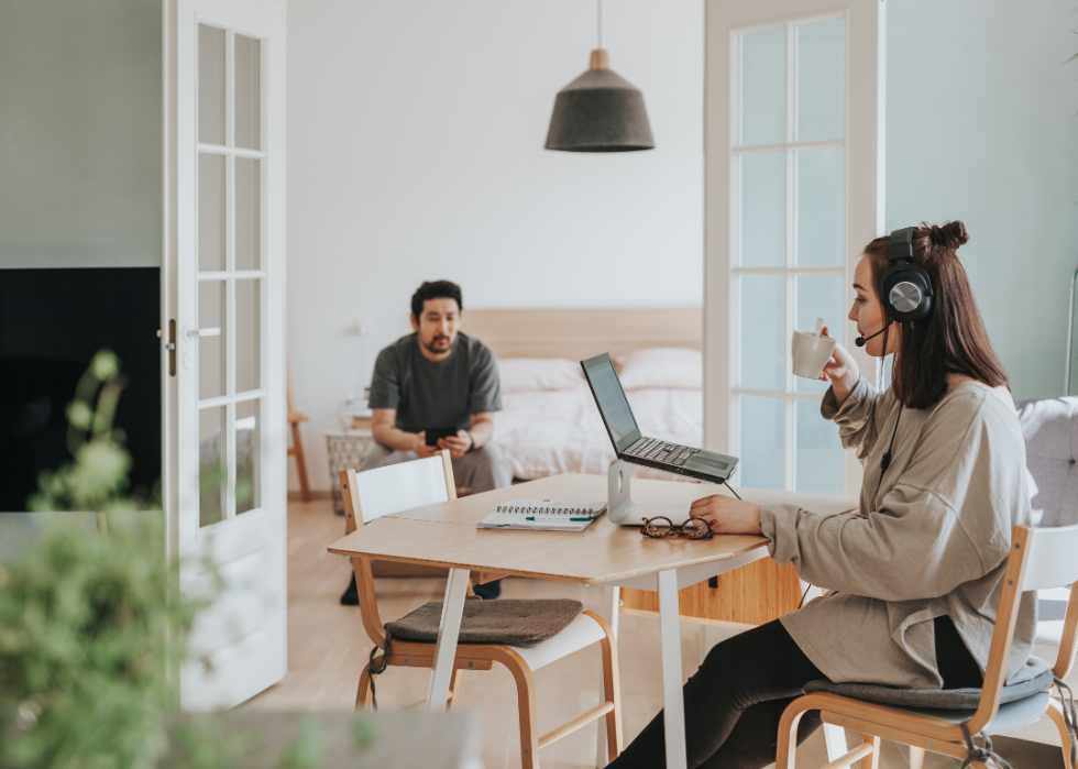 A young couple working from home with different jobs.