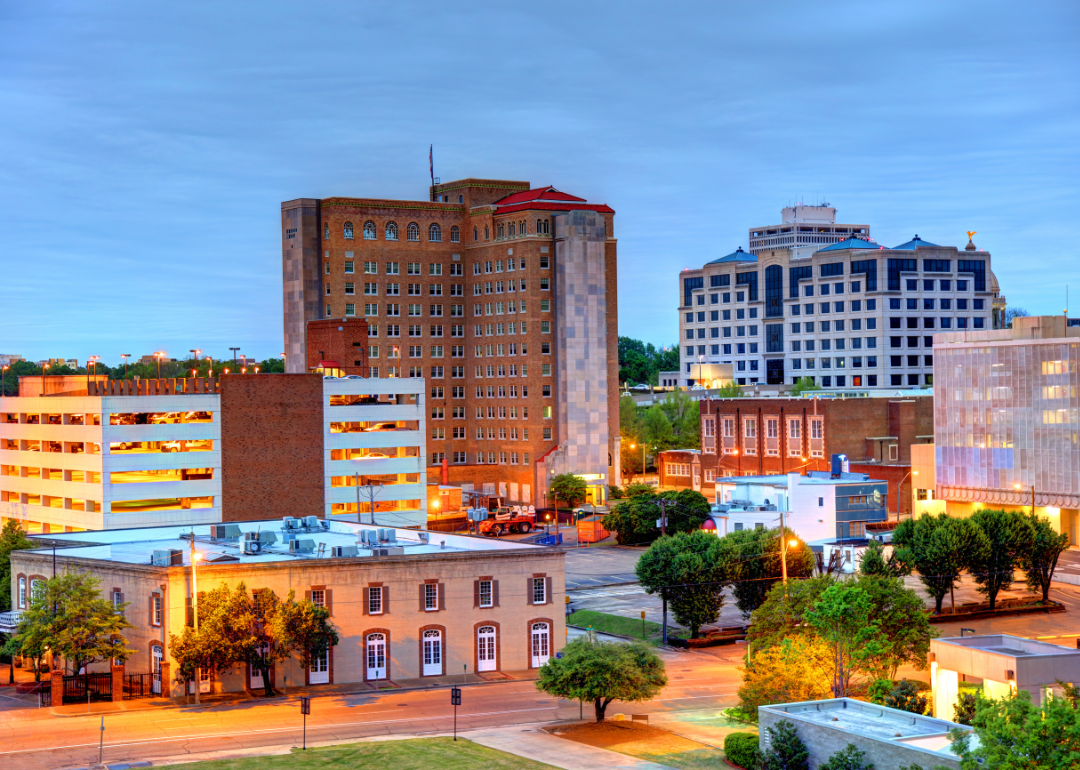 Downtown Jackson, MS at night with lit buildings.