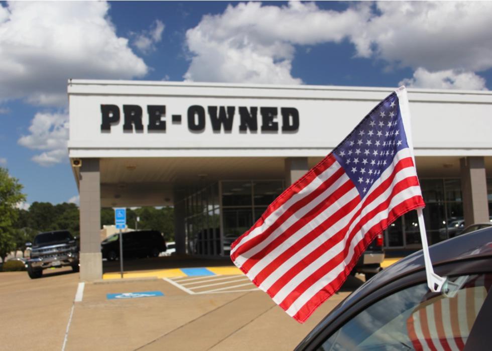 Pre-owned entrance at a dealership.