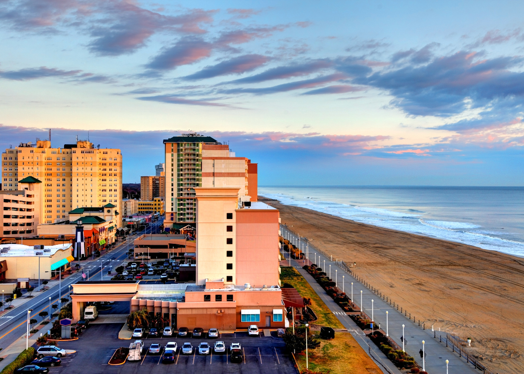 Aerial view of condos and businesses alongside the beach.