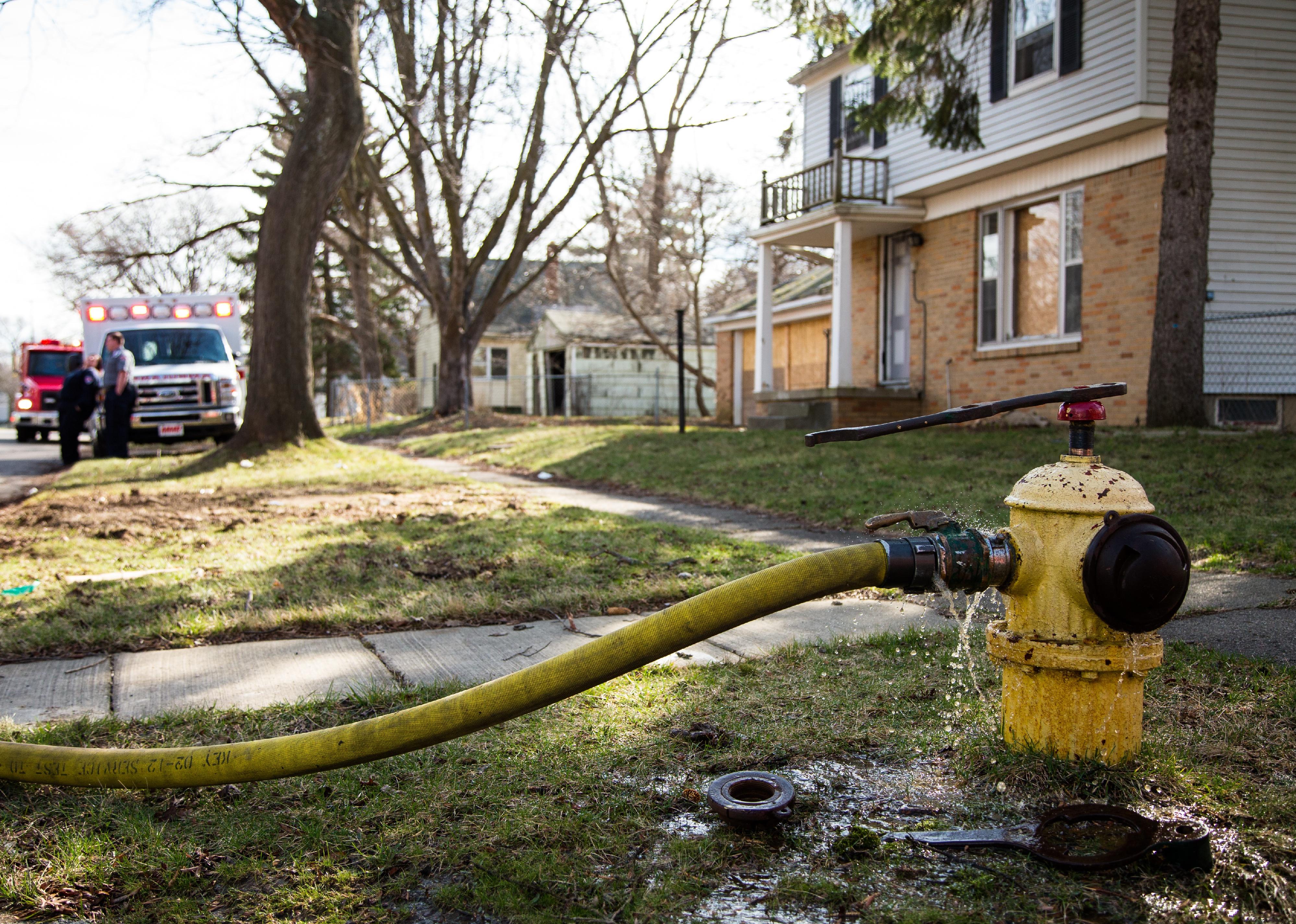 Discolored water leaks from a fire hydrant.