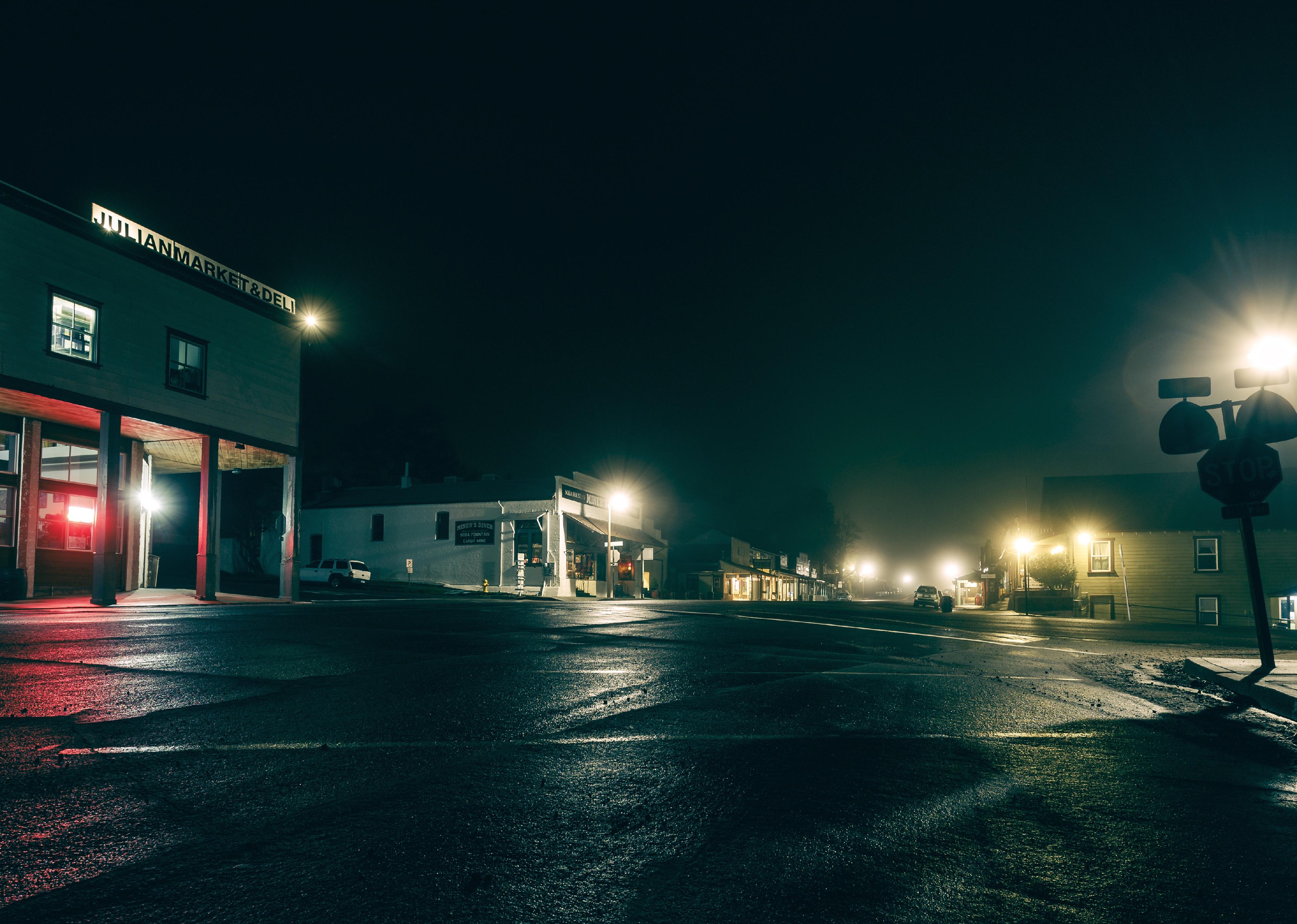 A dark intersection in a small town.