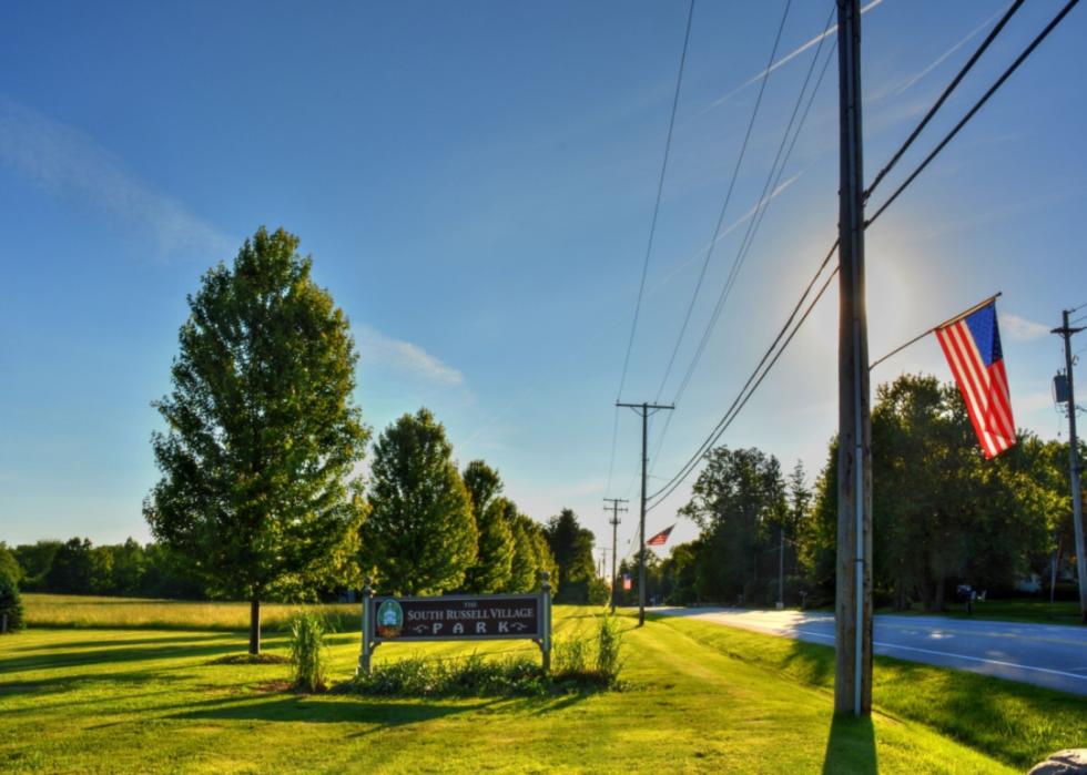 Entering South Russell sign with American flags.