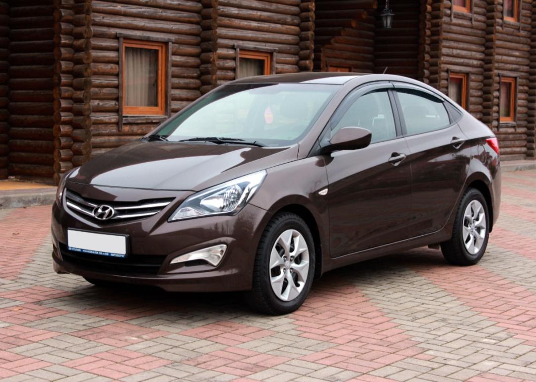 A brown Hyundai Accent.