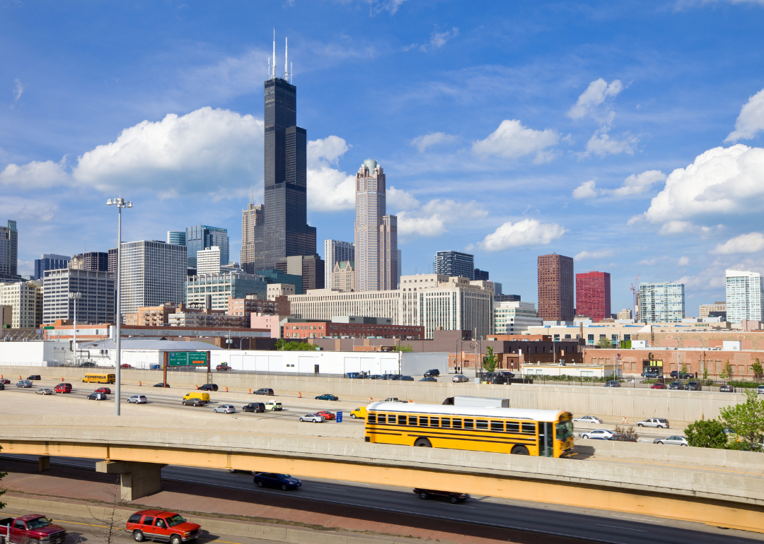 A busy overpass with downtown Chicago in the background.