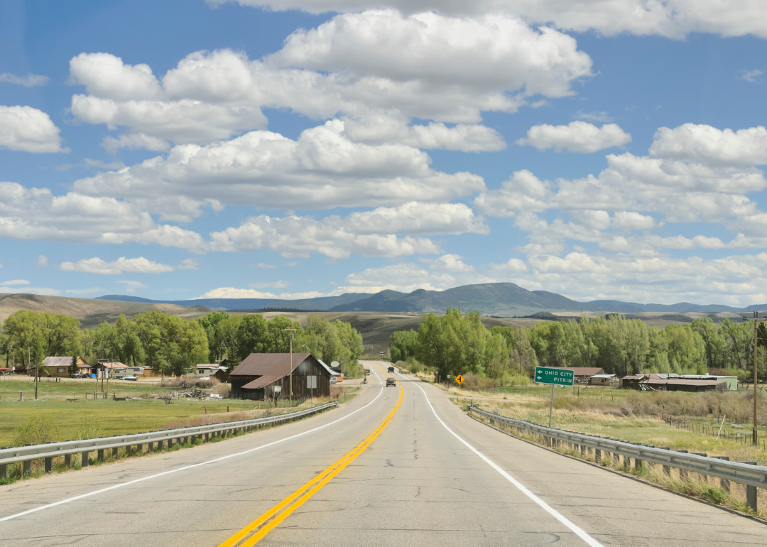A country road heading to the mountains.