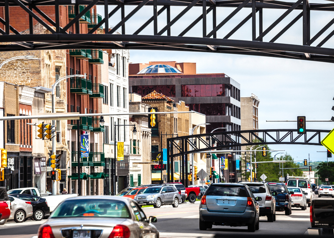 Traffic driving through historic buildings in Topeka, Kansas.