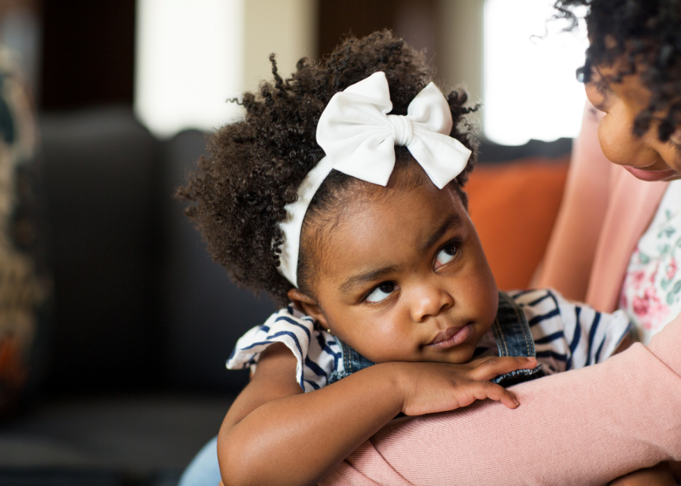 Baby looking up concentrating on her mom.