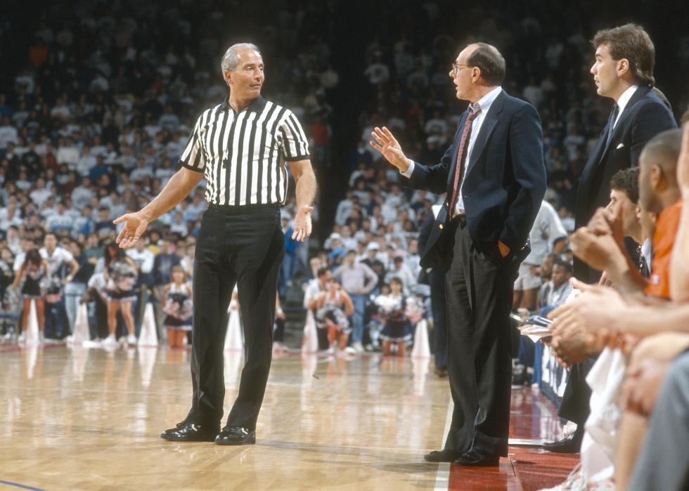 Head coach Jim Boeheim of the Syracuse Orangemen talks with an official.