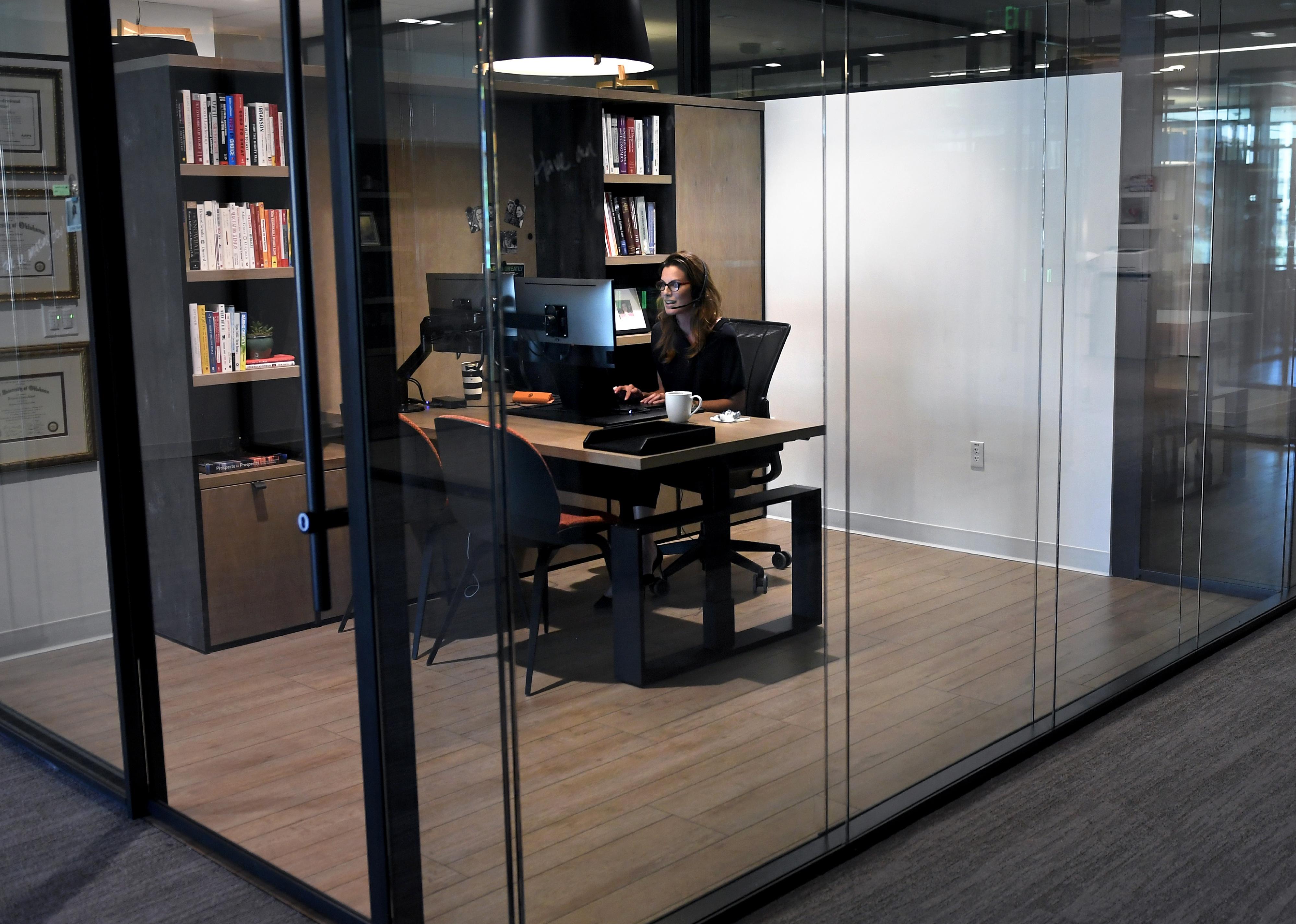 An employee working in her office at a desk