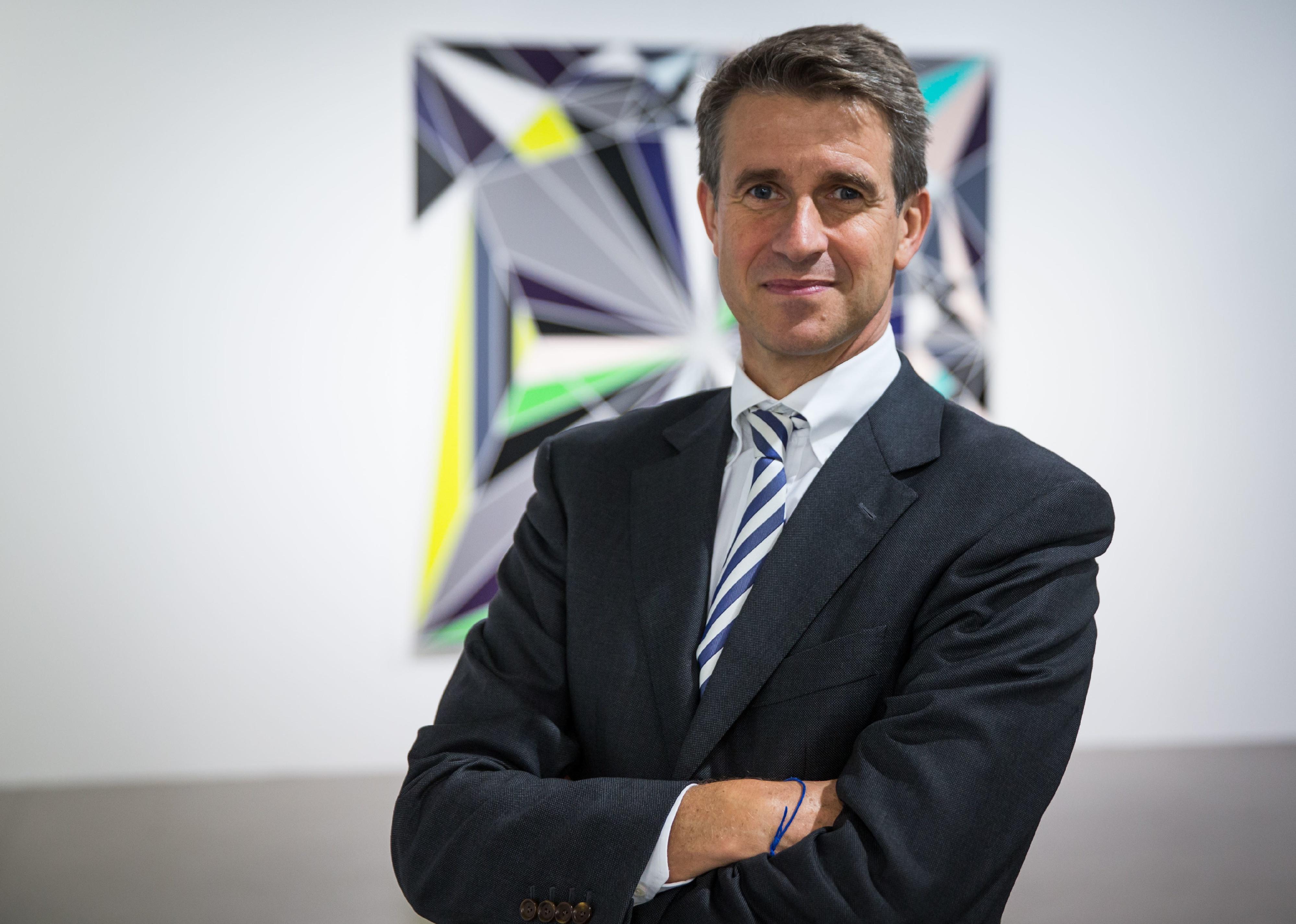 Stefan Quandt portrait with arms folded.