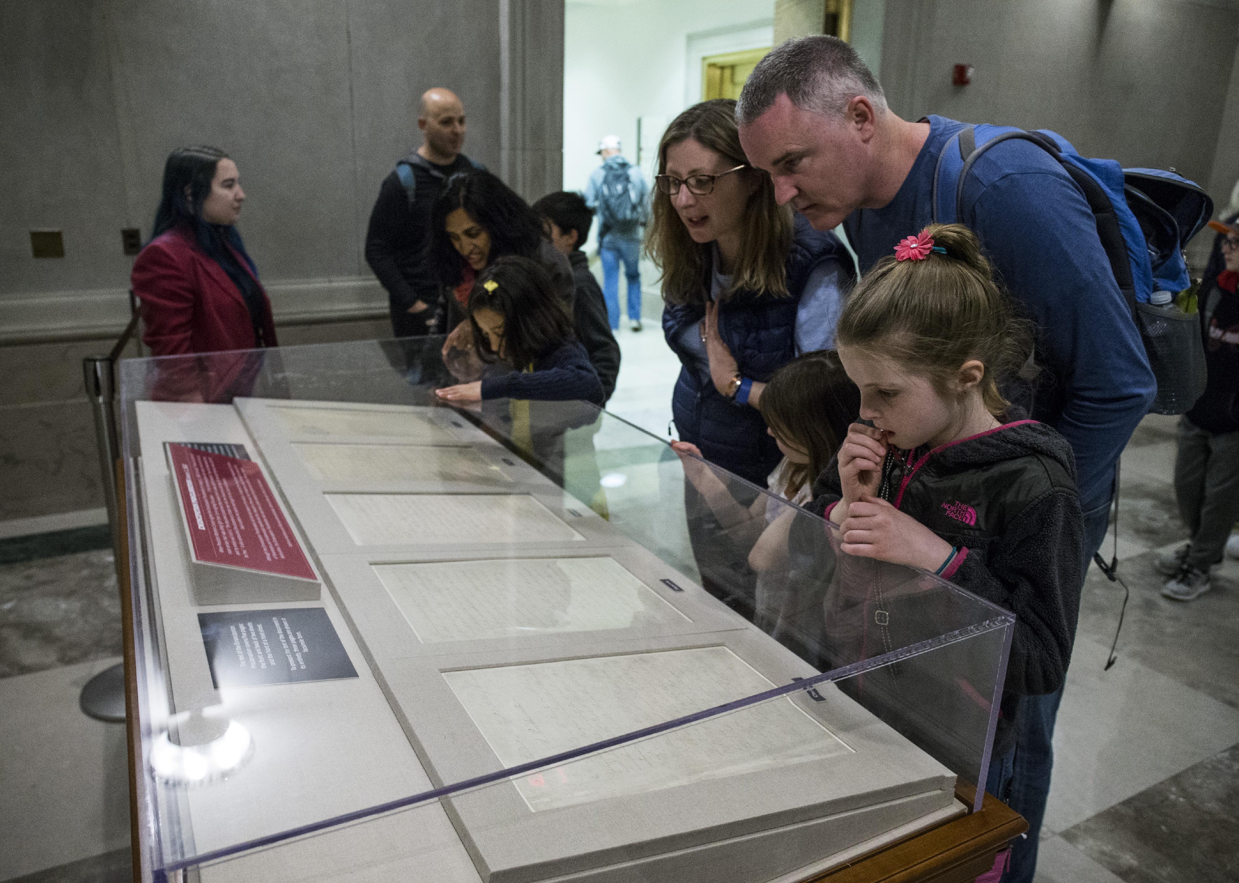 People look at the Emancipation Proclamation at the National Archives