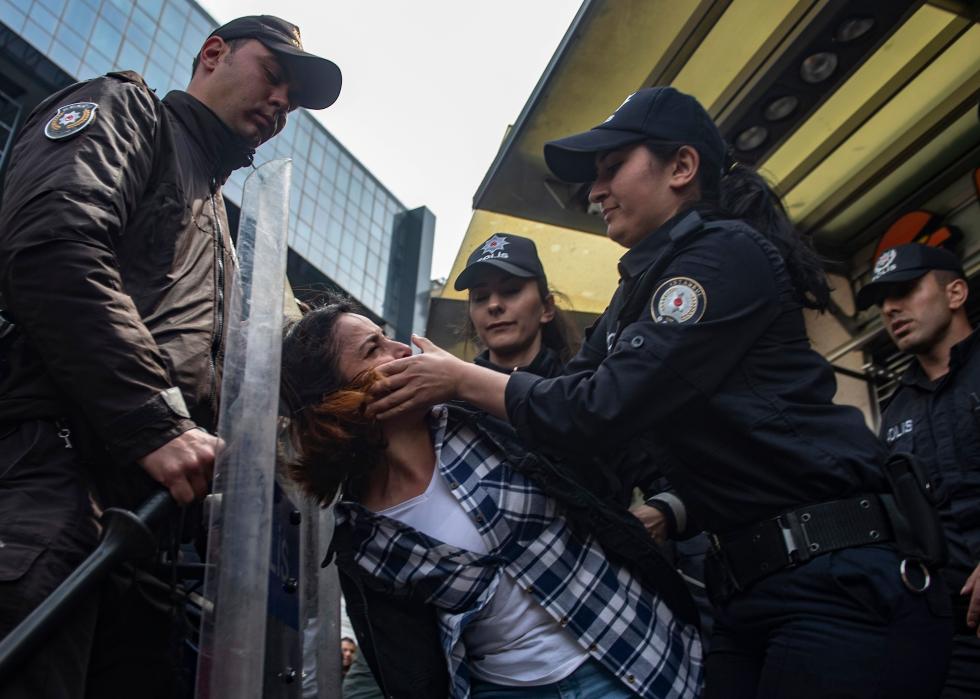 Turkish police detain a protester 