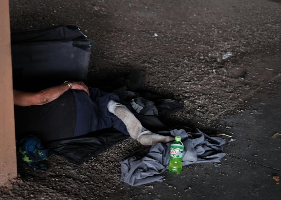 A person sleeps on the street in Albuquerque, New Mexico.