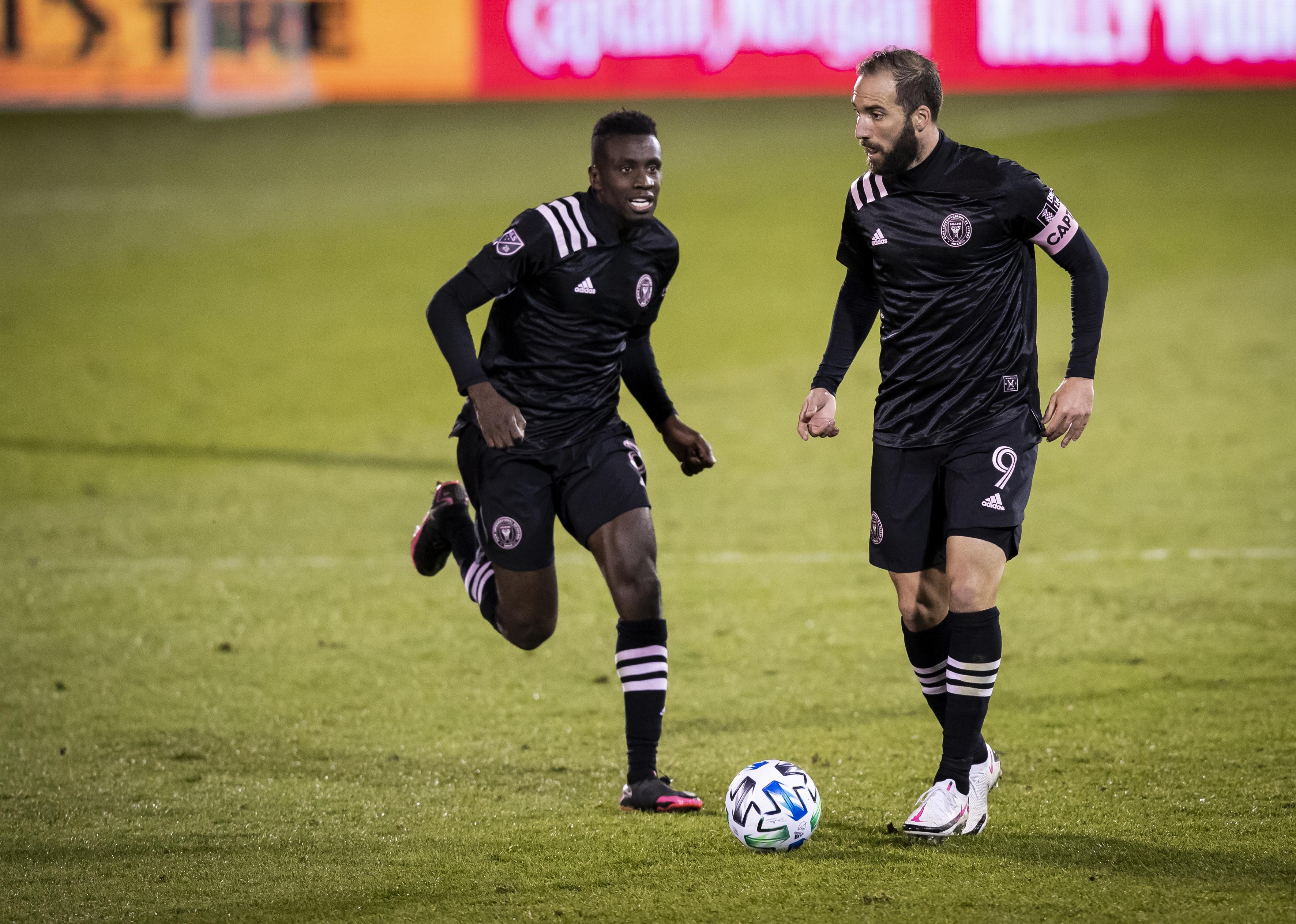 Captain Gonzalo Higuain and Blaise Matuidi of Inter Miami CF take the ball down the pitch.