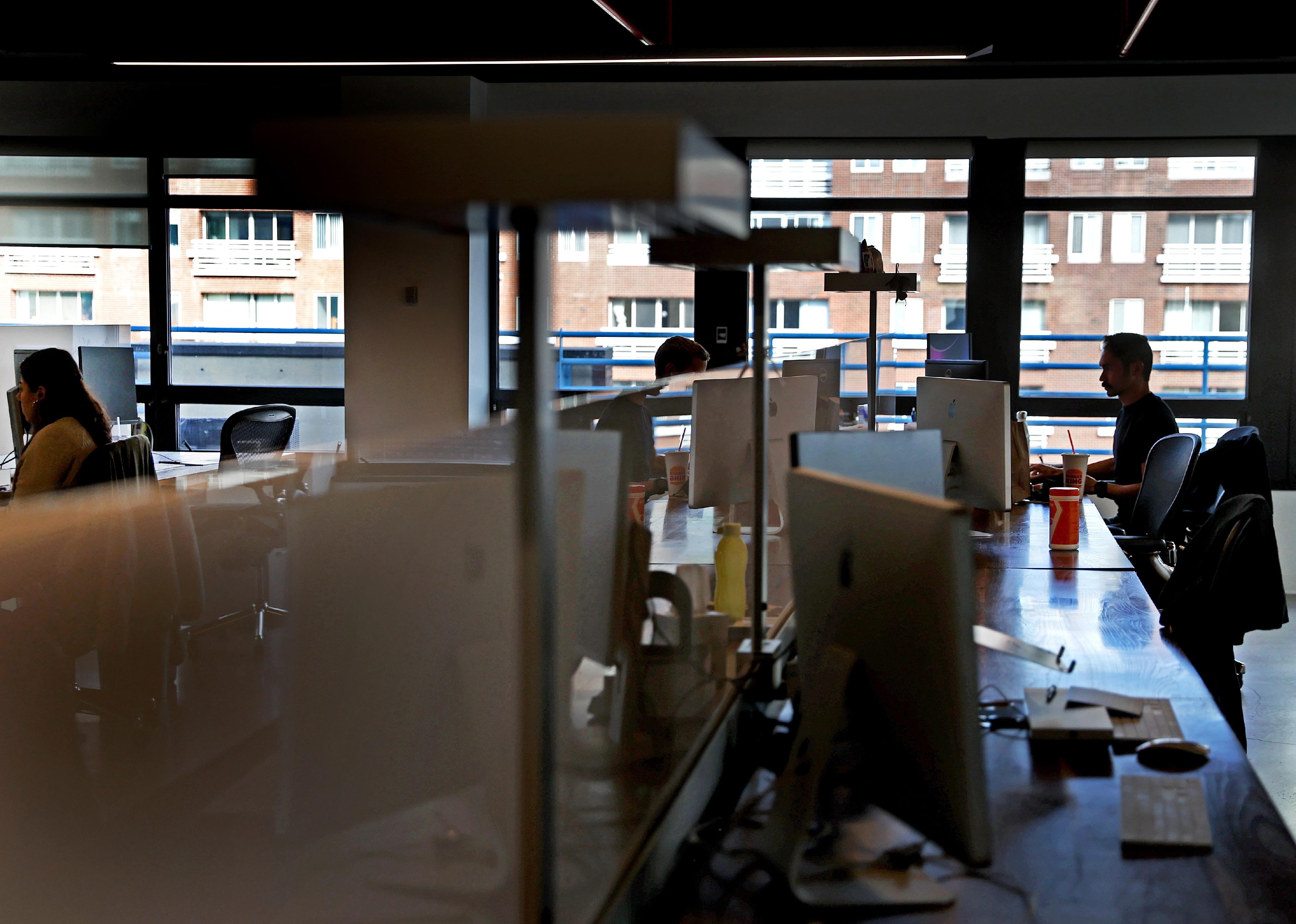 Employees at work in the Kayak office