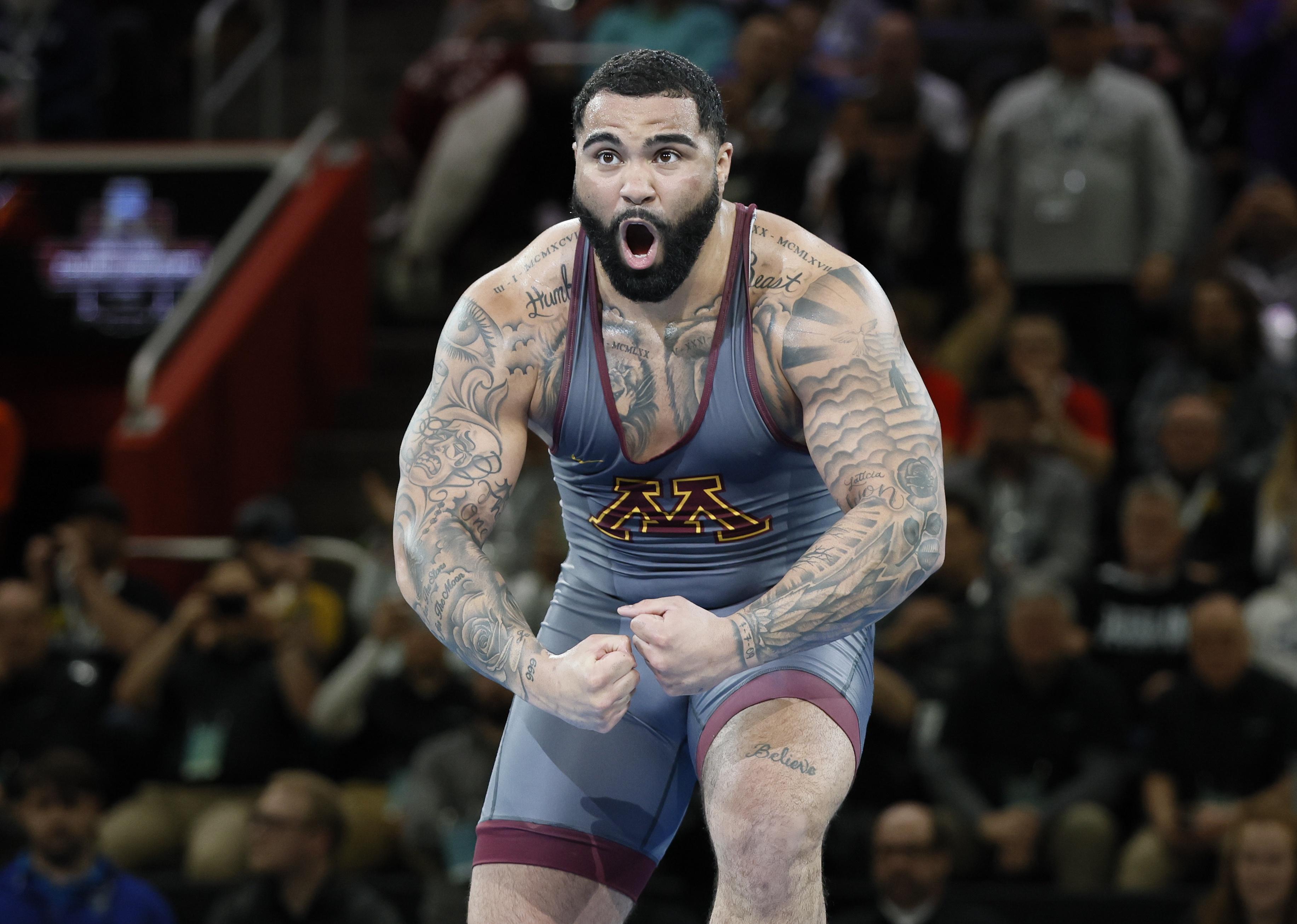 Gable Steveson of the Minnesota Golden Gophers celebrates a win.