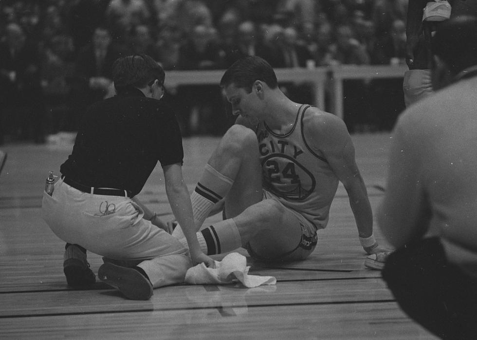 Rick Barry on the ground after an ankle injury