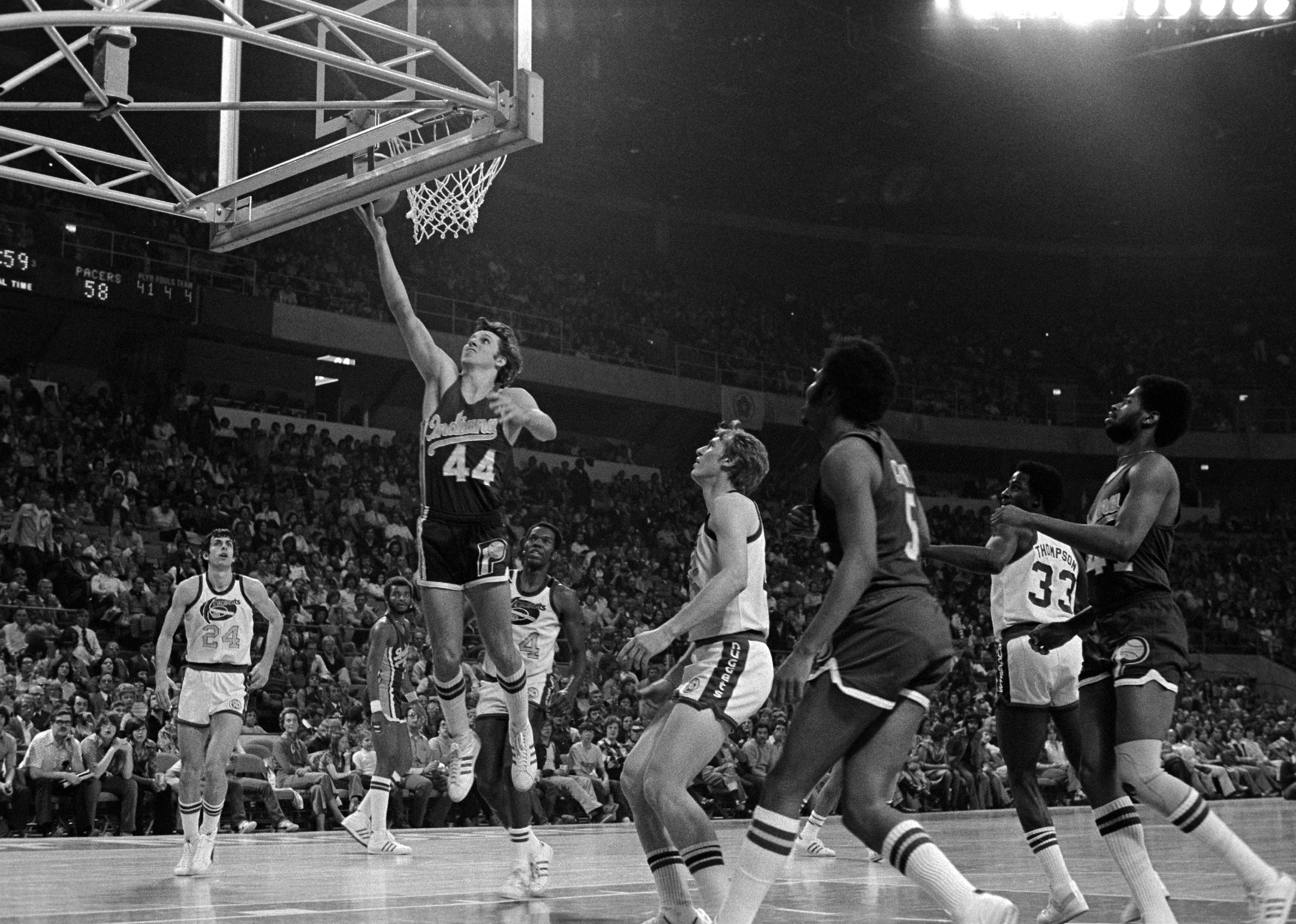 Mike Flynn shoots a driving layup during a game at McNichols Arena in Denver, Colorado.