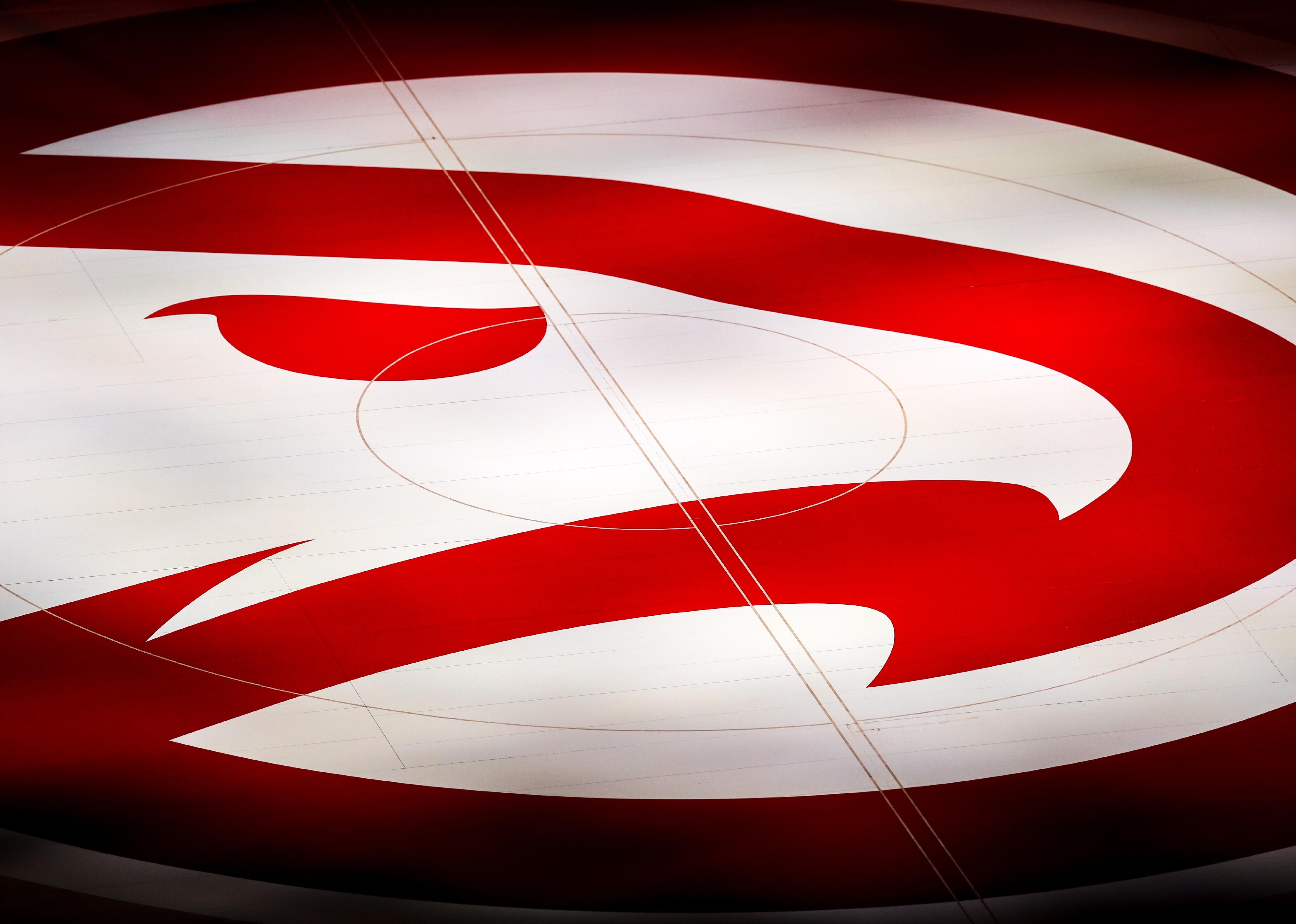 The Atlanta Hawks logo on the court at State Farm Arena.