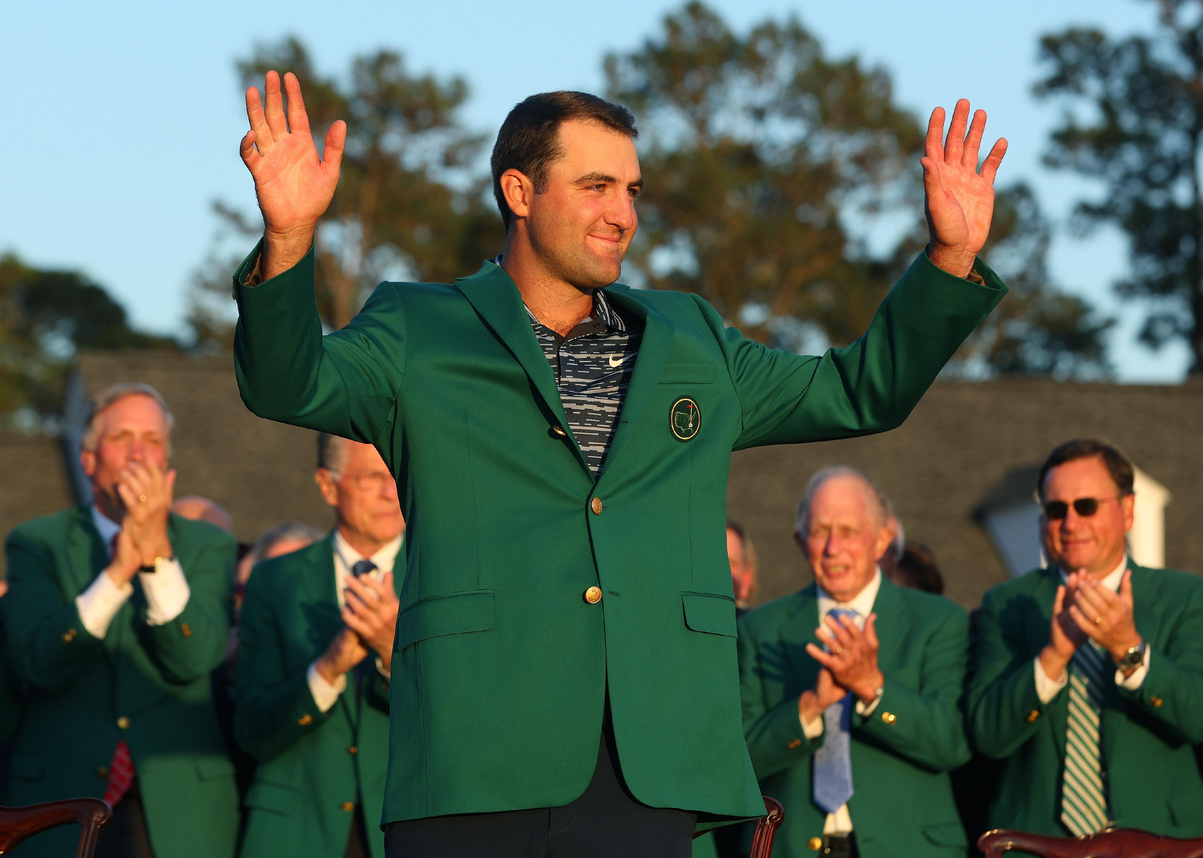 Scottie Scheffler celebrates after being awarded the Green Jacket