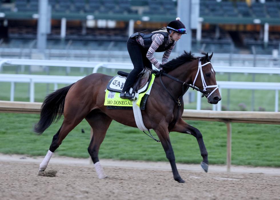Mo Donegal runs on the track during morning training