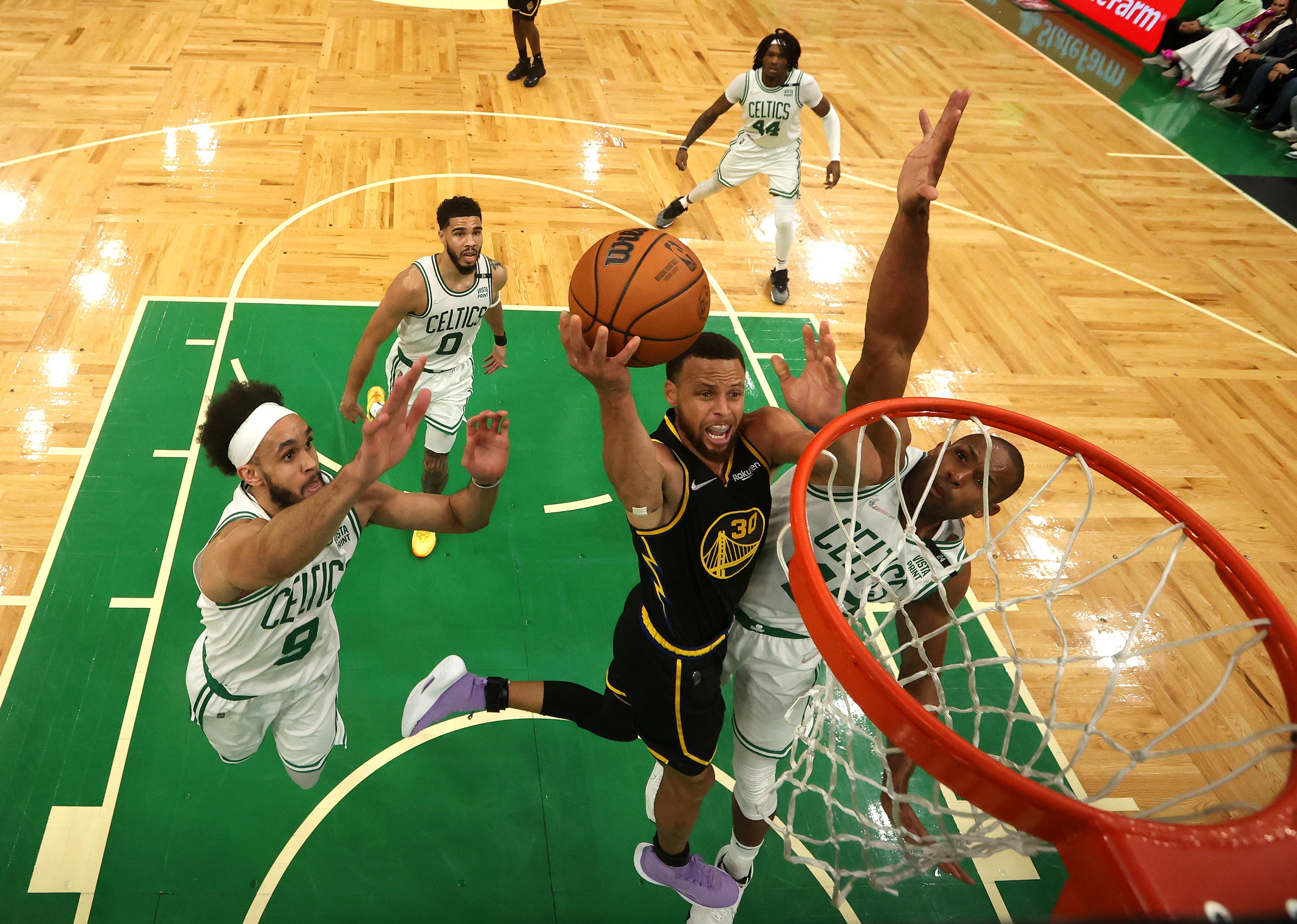 Stephen Curry of the Golden State Warriors drives to the basket