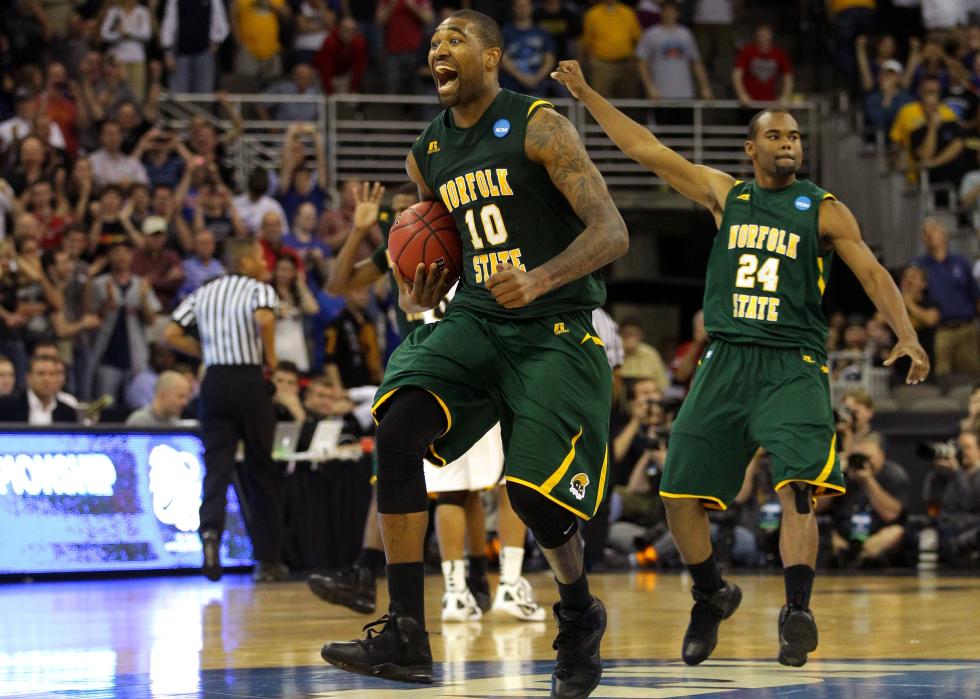 Kyle O'Quinn and Brandon Wheeless celebrate after they won 86-84 against the Missouri Tigers.