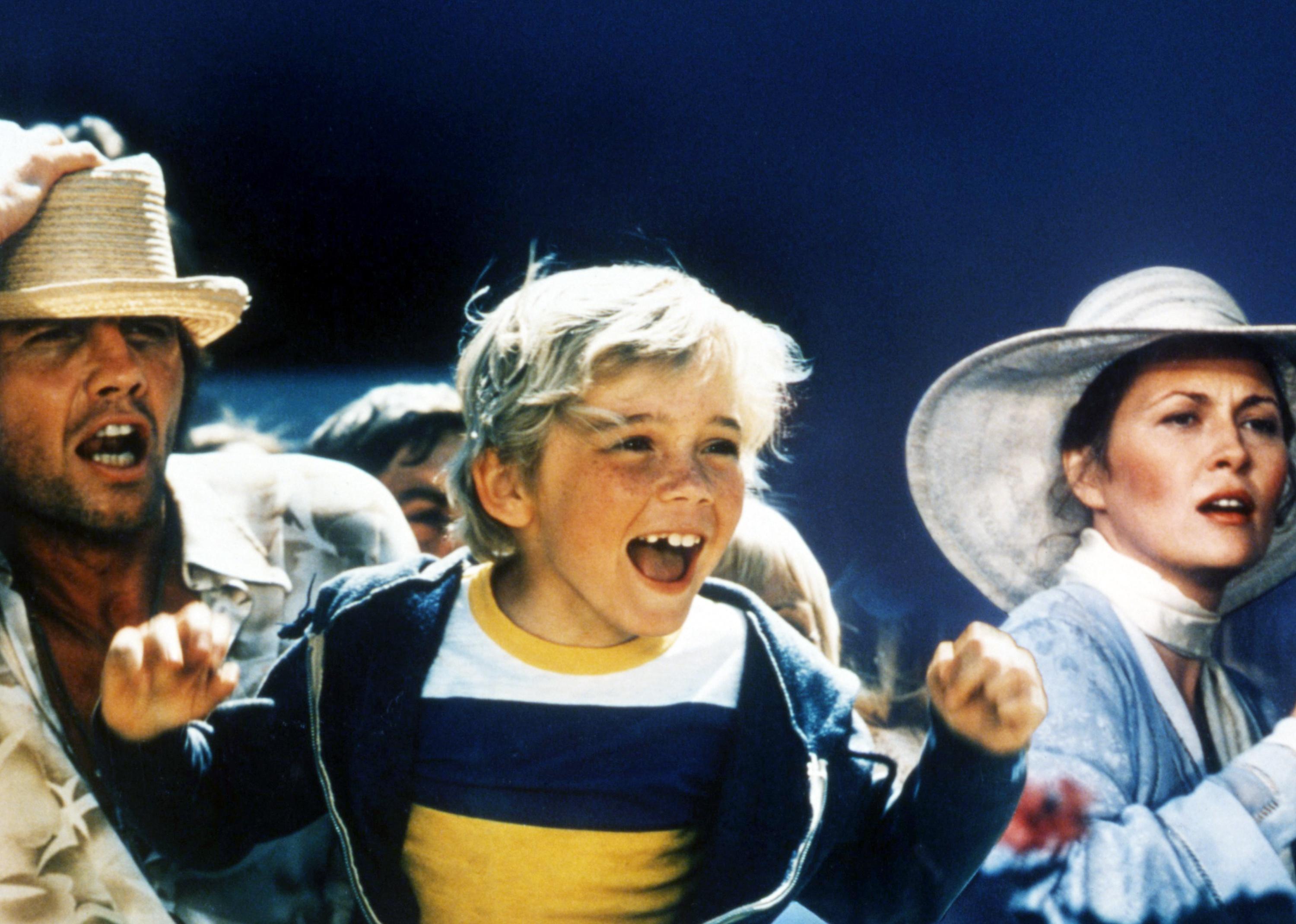 Jon Voight as Billy Flynn, Ricky Schroder as TJ, and Faye Dunaway as Annie in 'The Champ'.