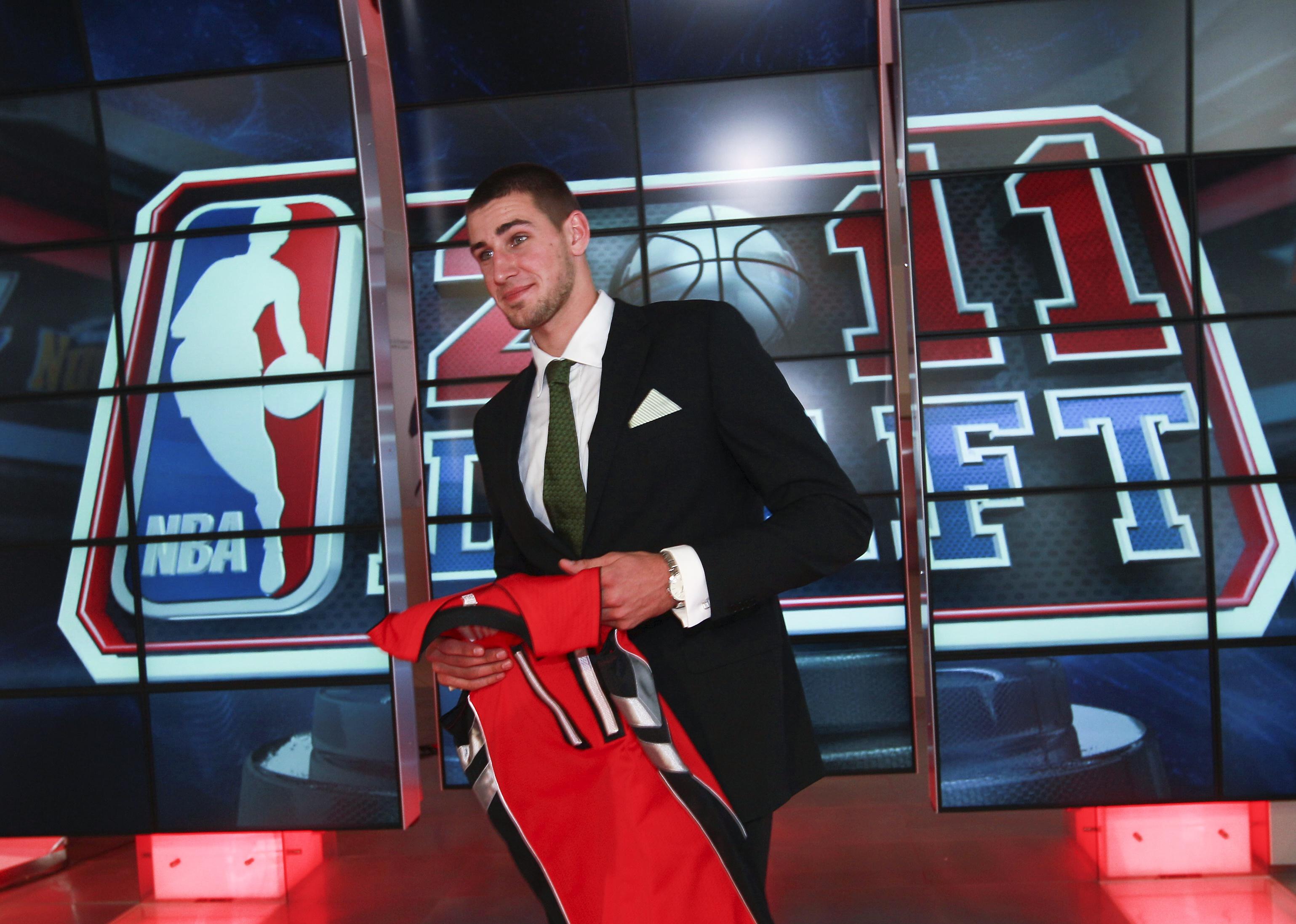Jonas Valaciunas holding his number 17 jersey. 