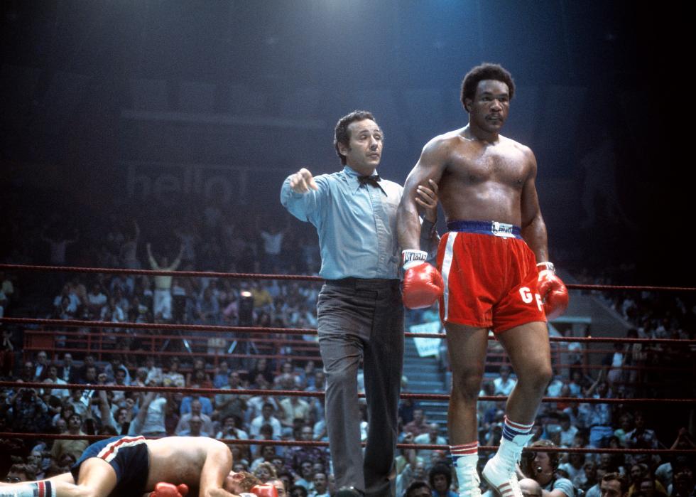 George Foreman walks to his corner during a fight