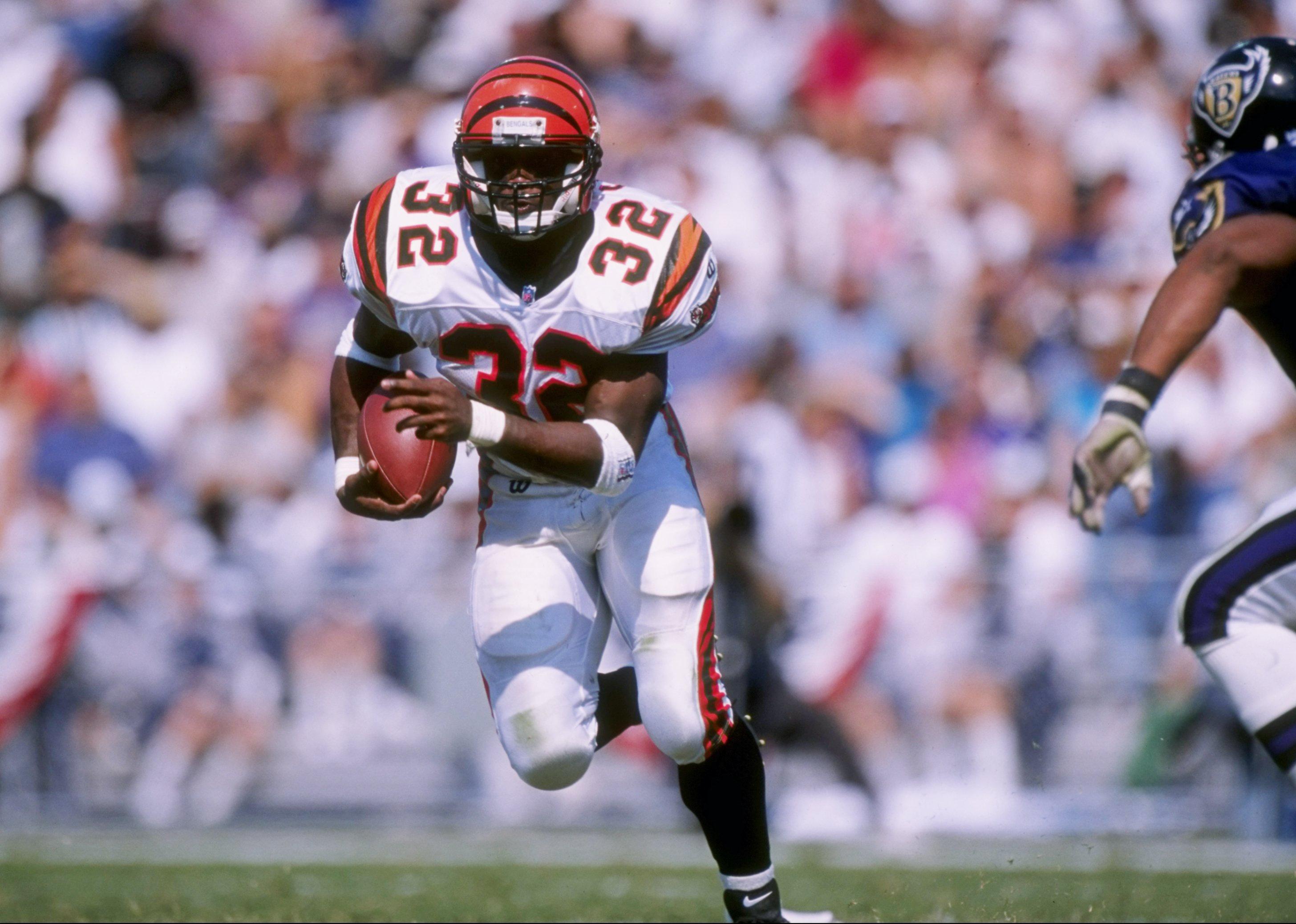 Ki-Jana Carter of the Cincinnati Bengals carries the football during a game.