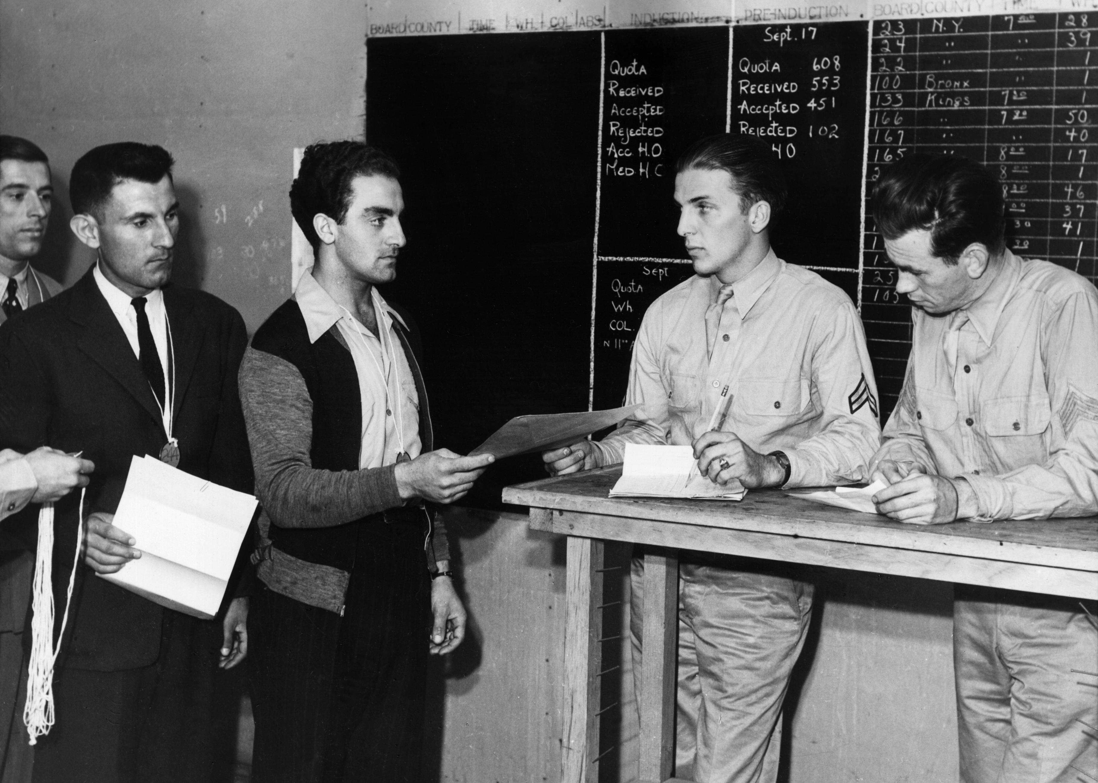 Draftees reporting for physical examination at the US induction center on Governor's Island.