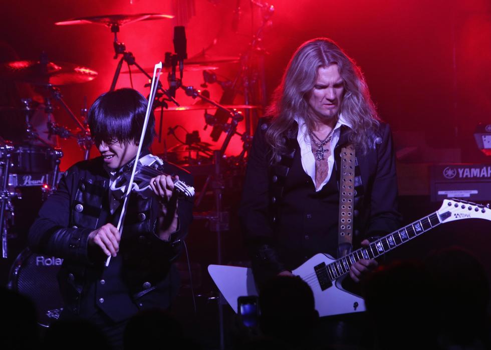 Two musicians playing onstage.