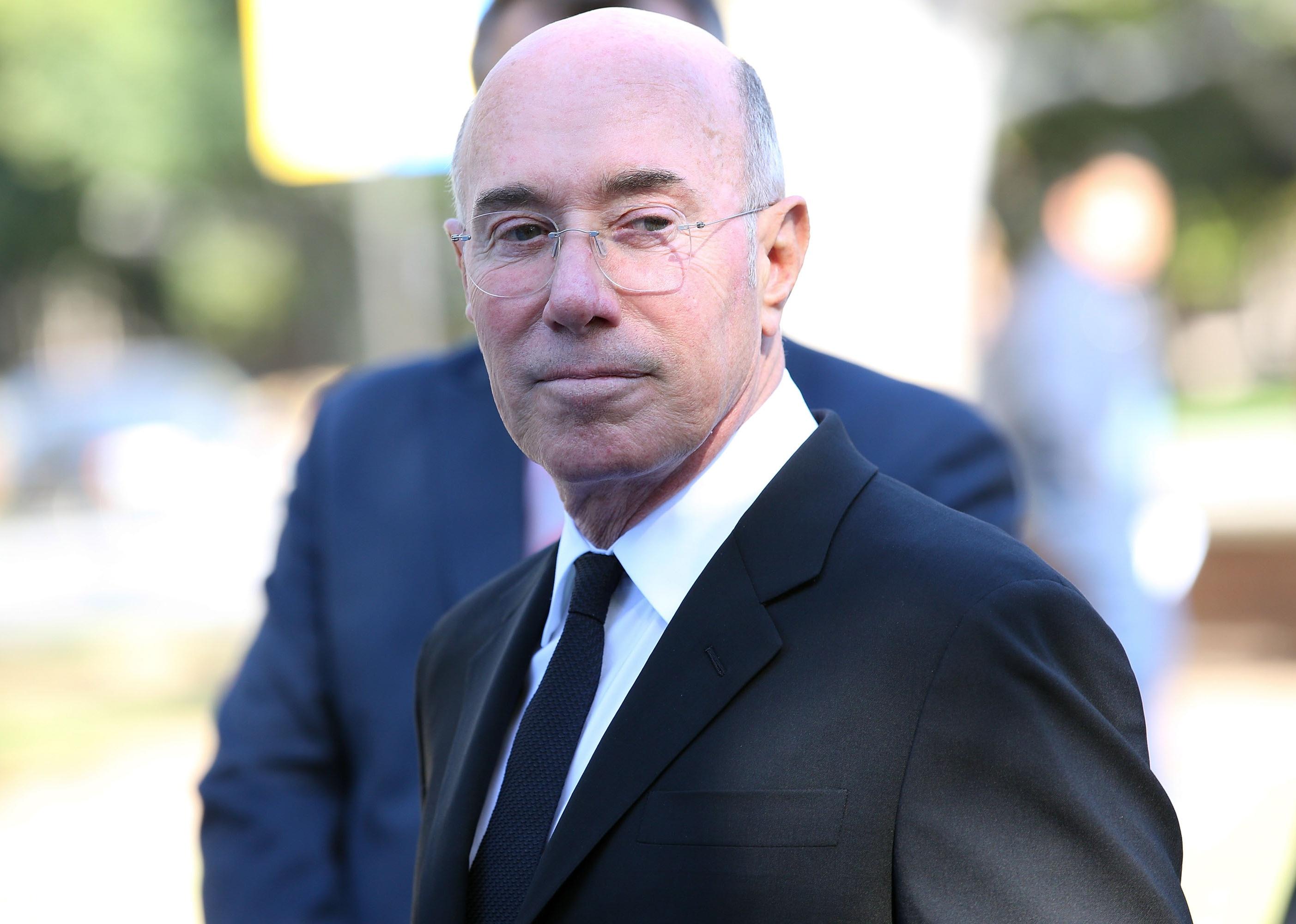 Close up of David Geffen outside.