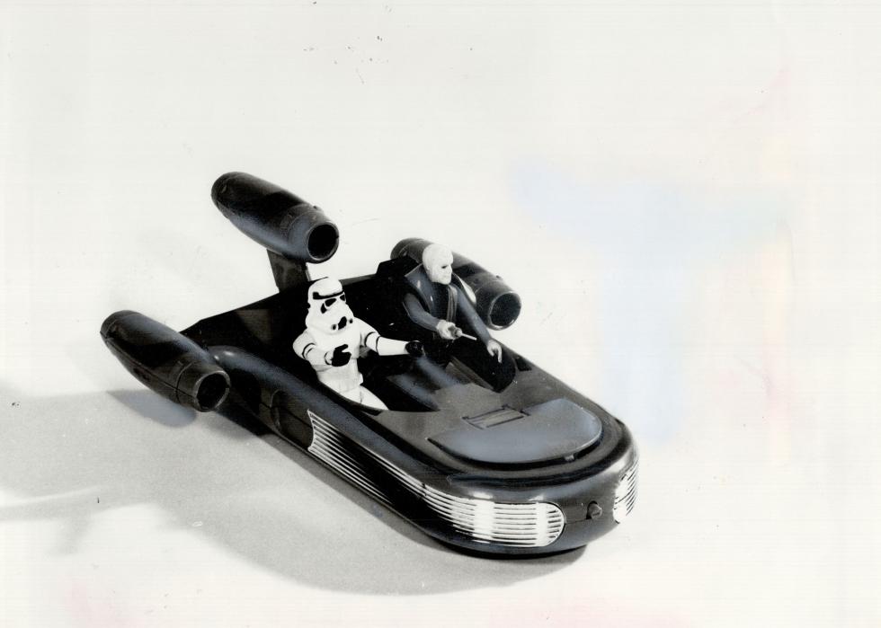 A plastic Star Wars toy on a white background.