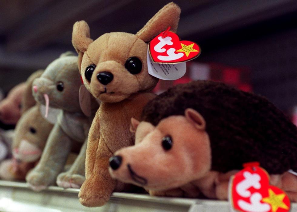 Plush Beanie Baby toys on a shelf.