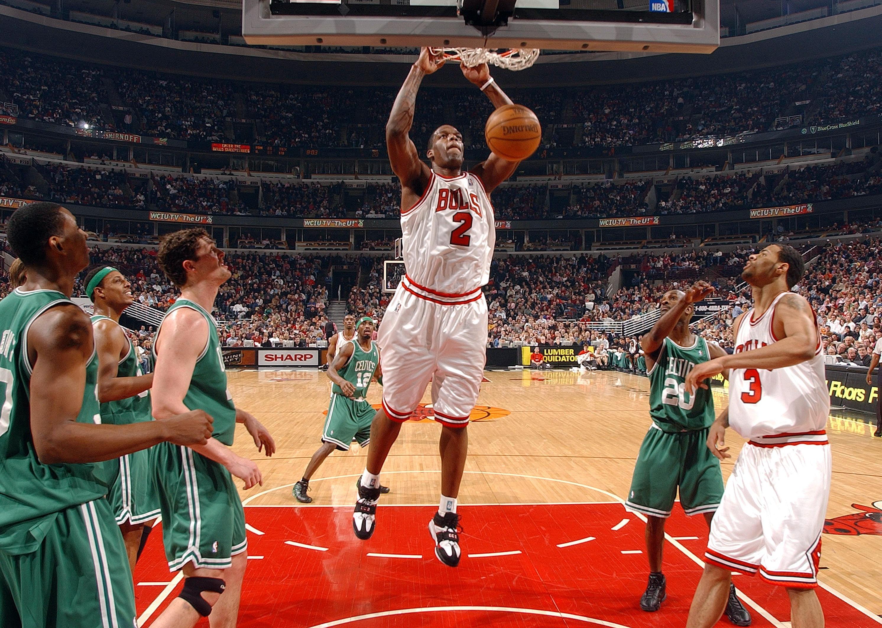 Eddy Curry of the Chicago Bulls slams the ball against the Boston Celtics.